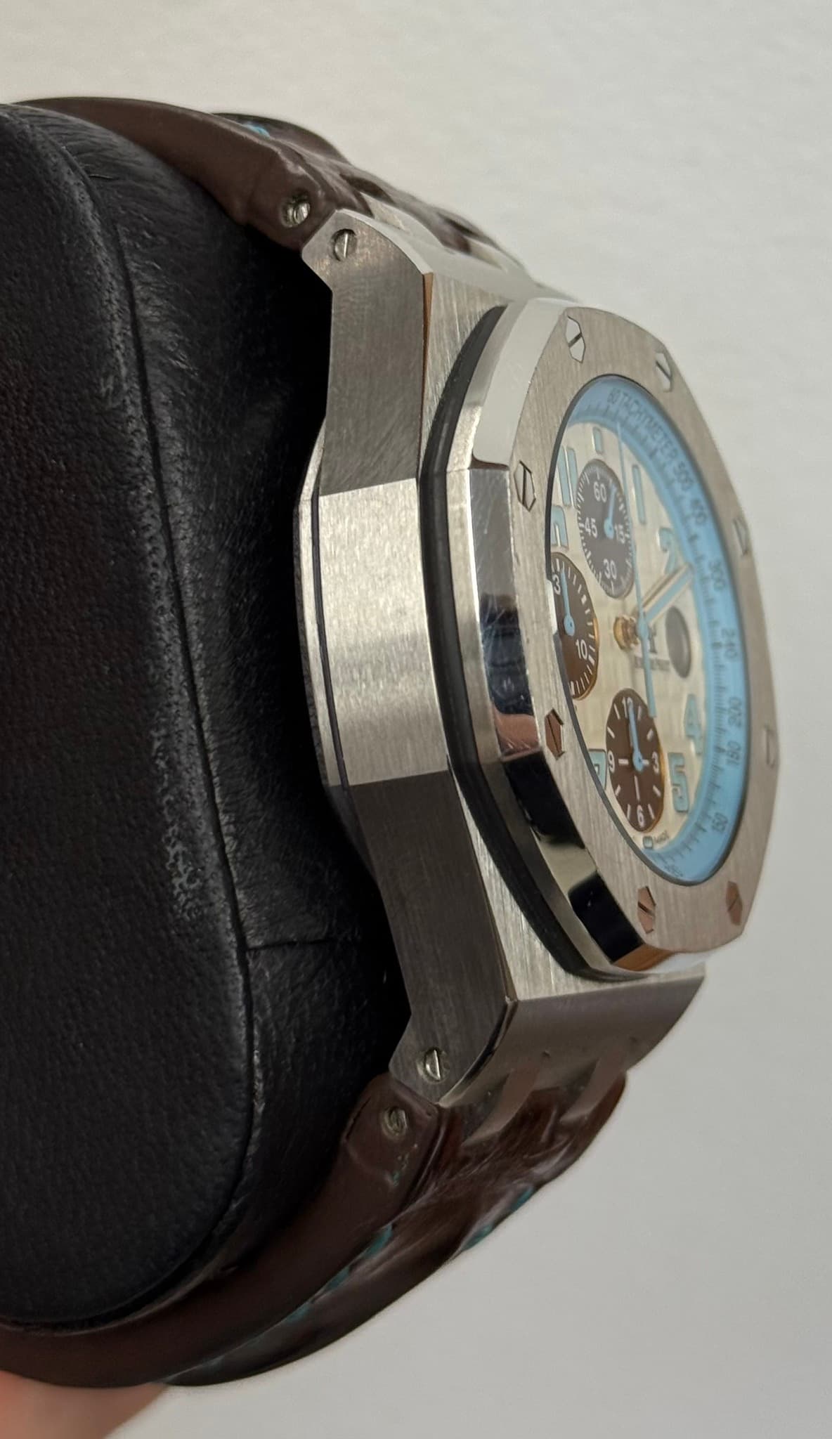 May be an image of wrist watch and text