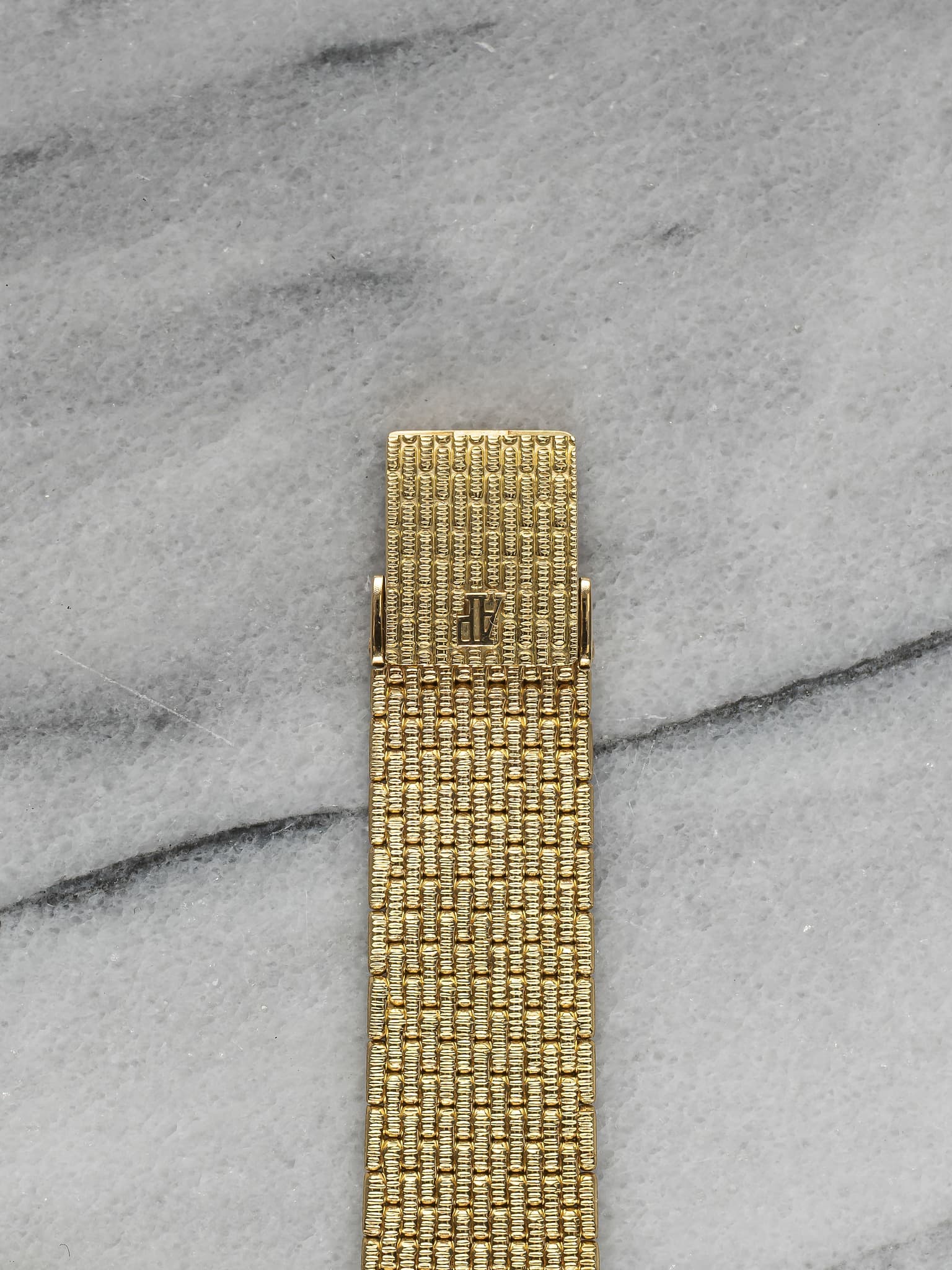 May be an image of jewelry and brass