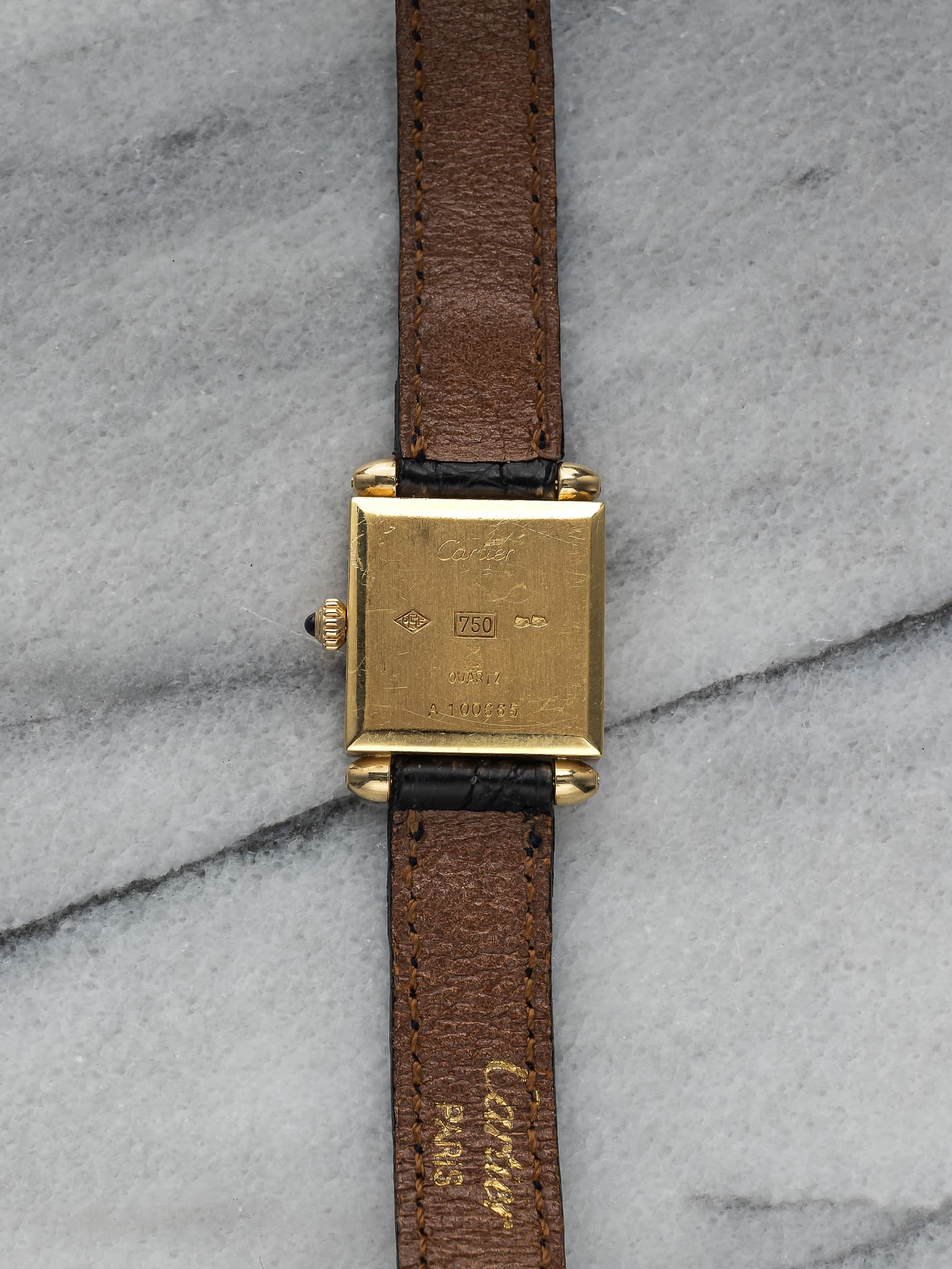 May be an image of wrist watch, leather and saddle-stitched leather