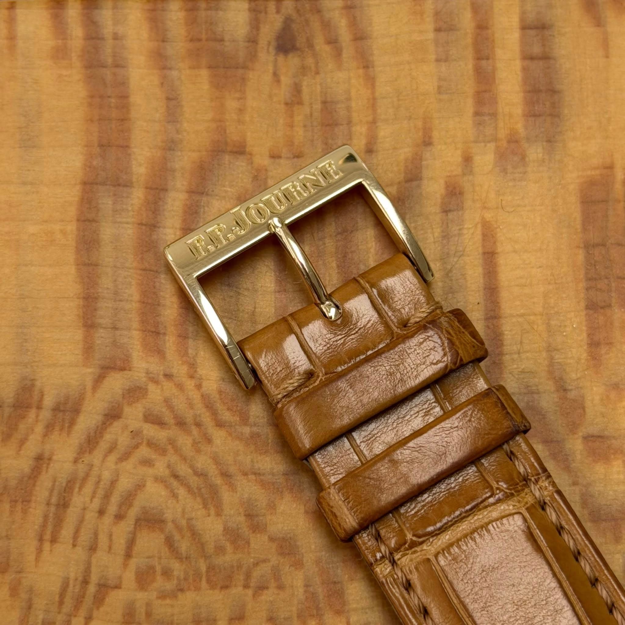 May be an image of wrist watch, leather and saddle-stitched leather