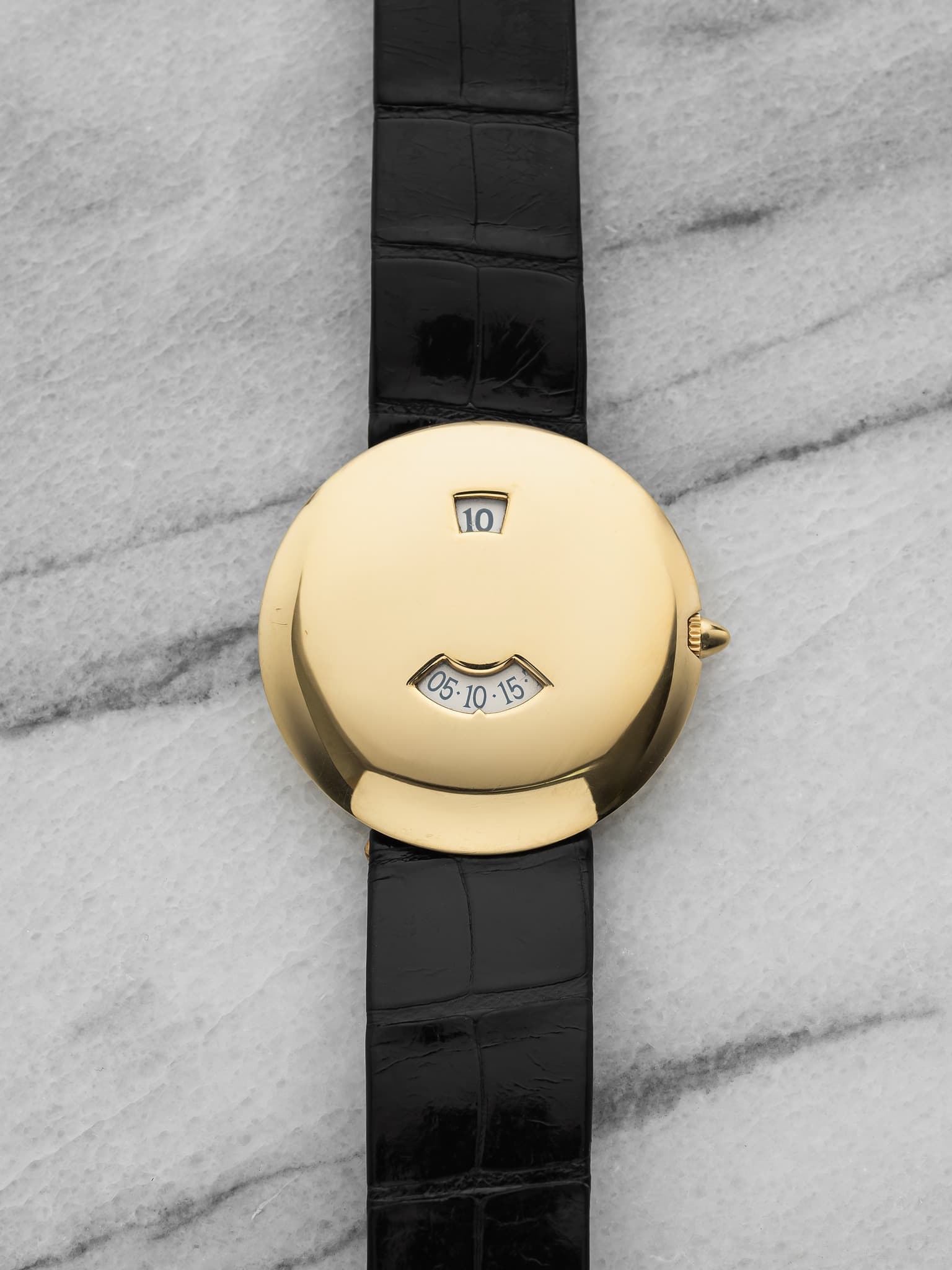 May be an image of wrist watch and text