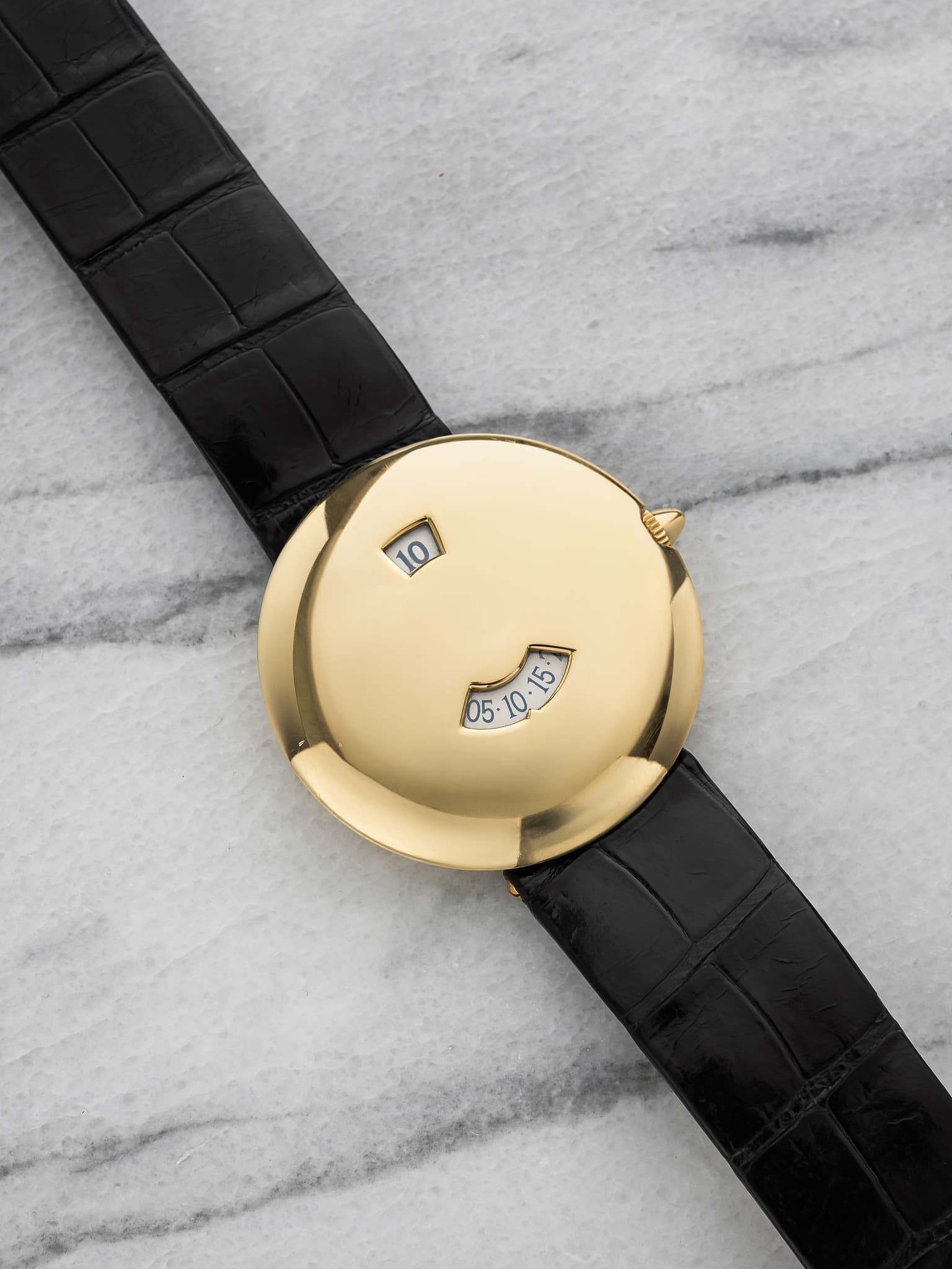 May be an image of wrist watch and text