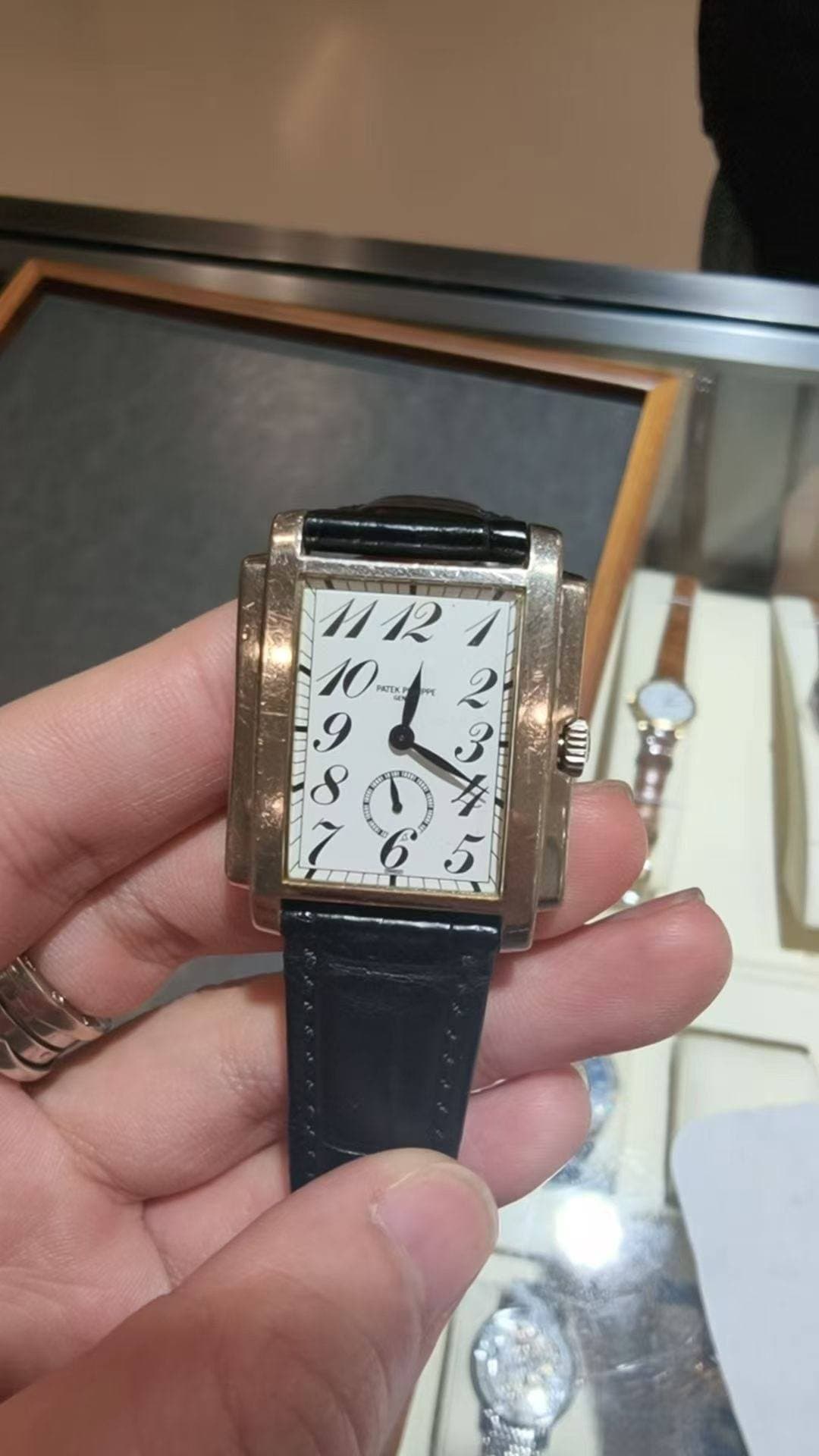 May be an image of wrist watch and text