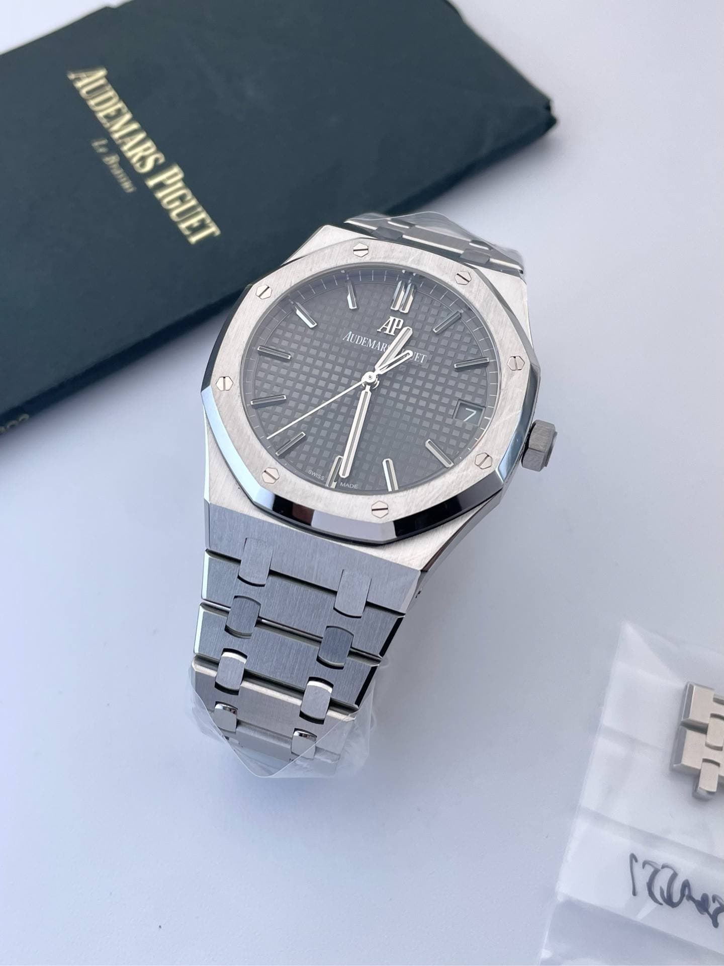 May be an image of wrist watch and text