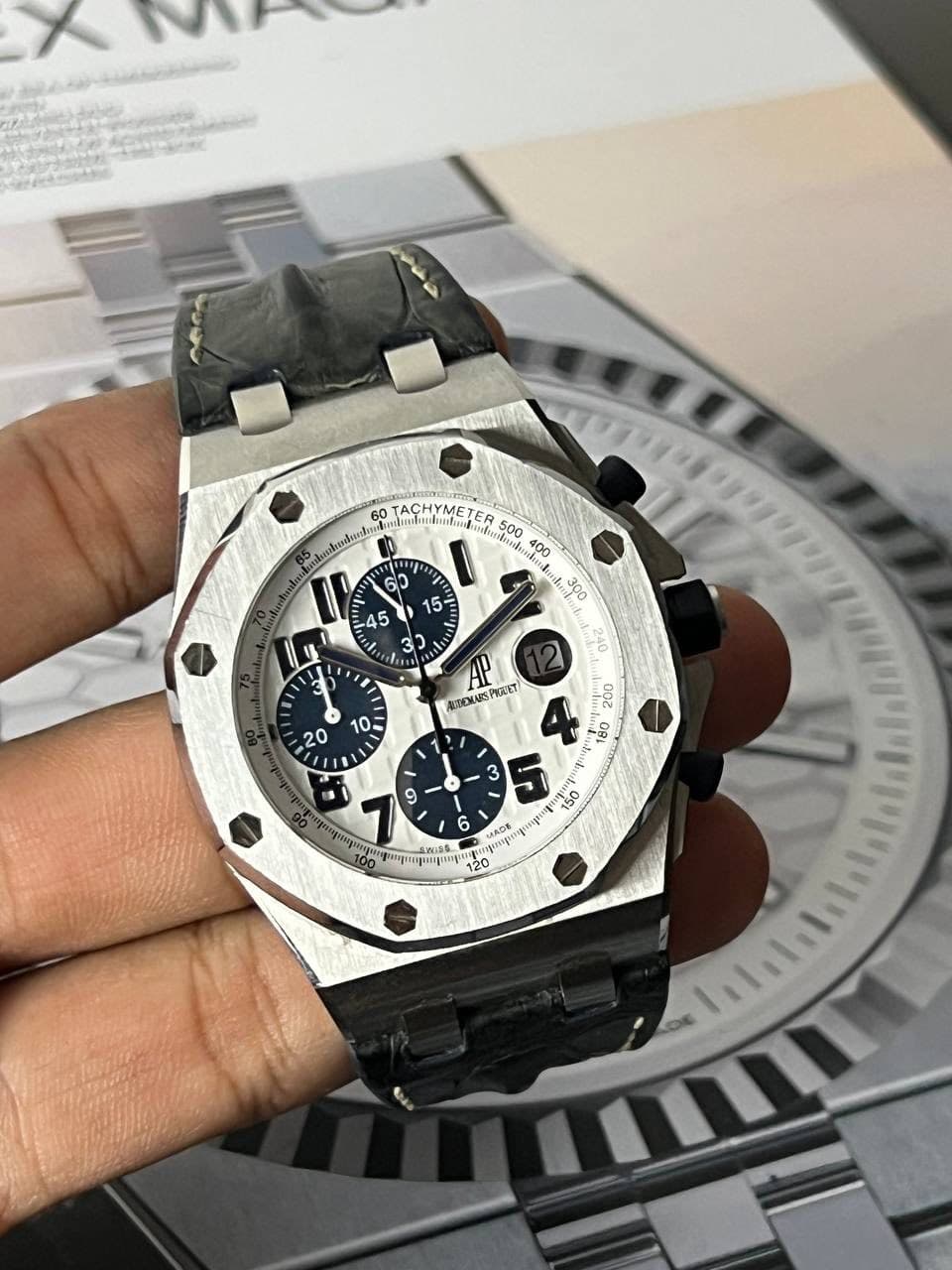 May be an image of wrist watch and text
