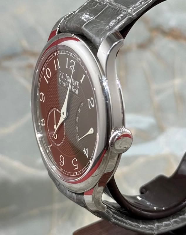 May be an image of wrist watch and text