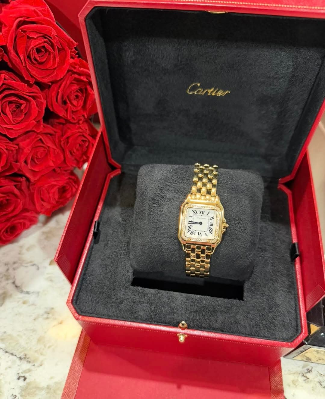 May be an image of wrist watch and text