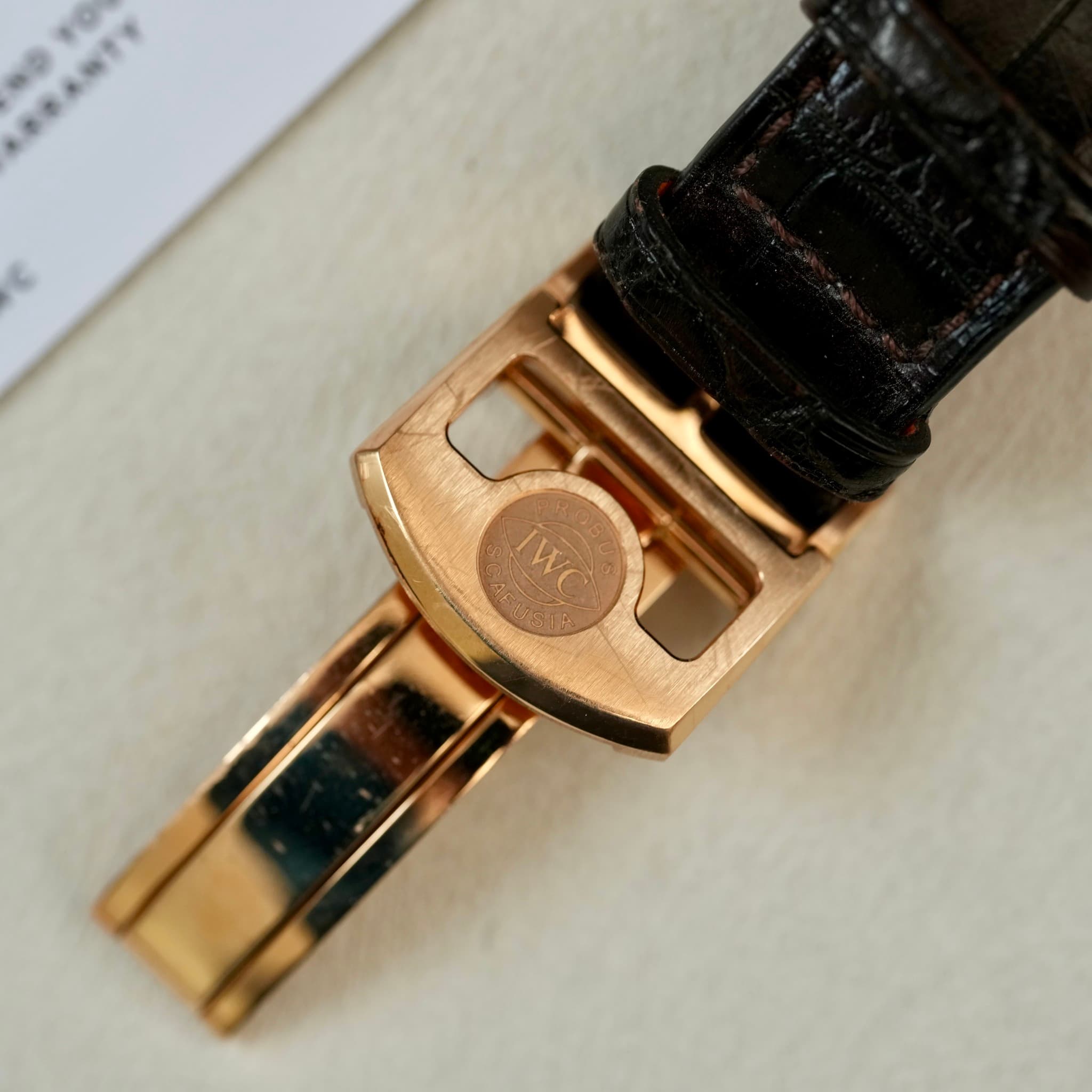 May be an image of wrist watch, saddle-stitched leather and text that says '2 WC 08'
