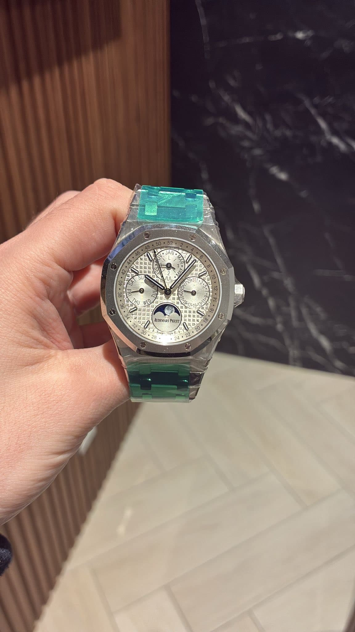 May be an image of wrist watch and text