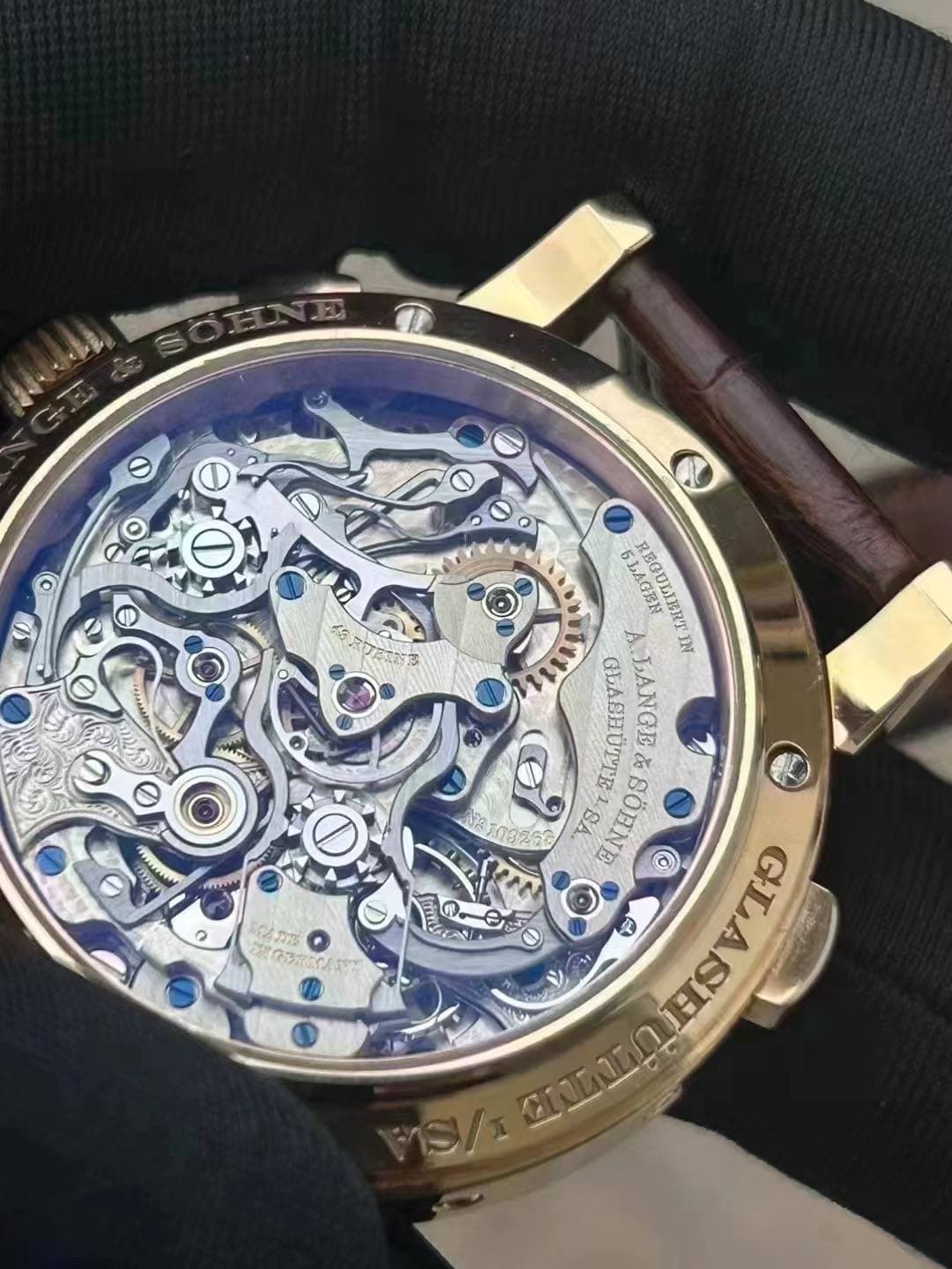May be an image of wrist watch and text