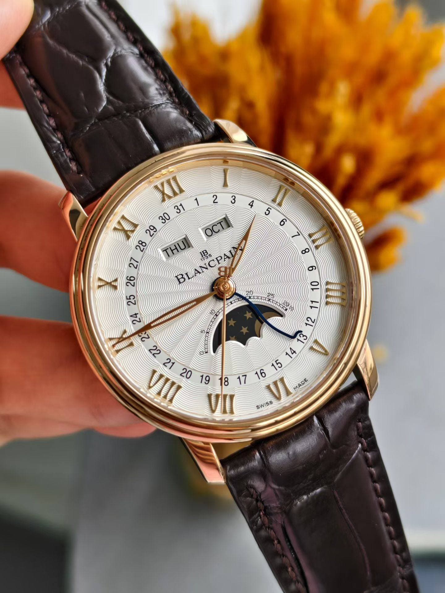 May be an image of wrist watch and text that says 'I M ထ 1ኖጣቨን OCTI 28 THUI BLANCPA IB 27 က 26 10 25 "H0 4ИAE AT က 23 14 SiaAA VII VI MADE SWISS MEEEU Ka3 ce'