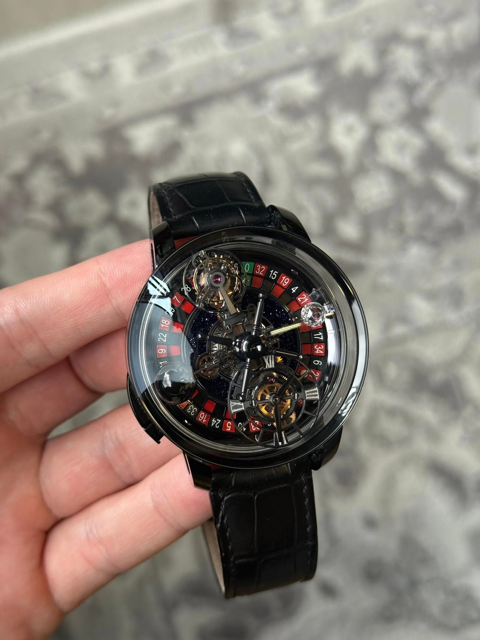 May be an image of wrist watch and text