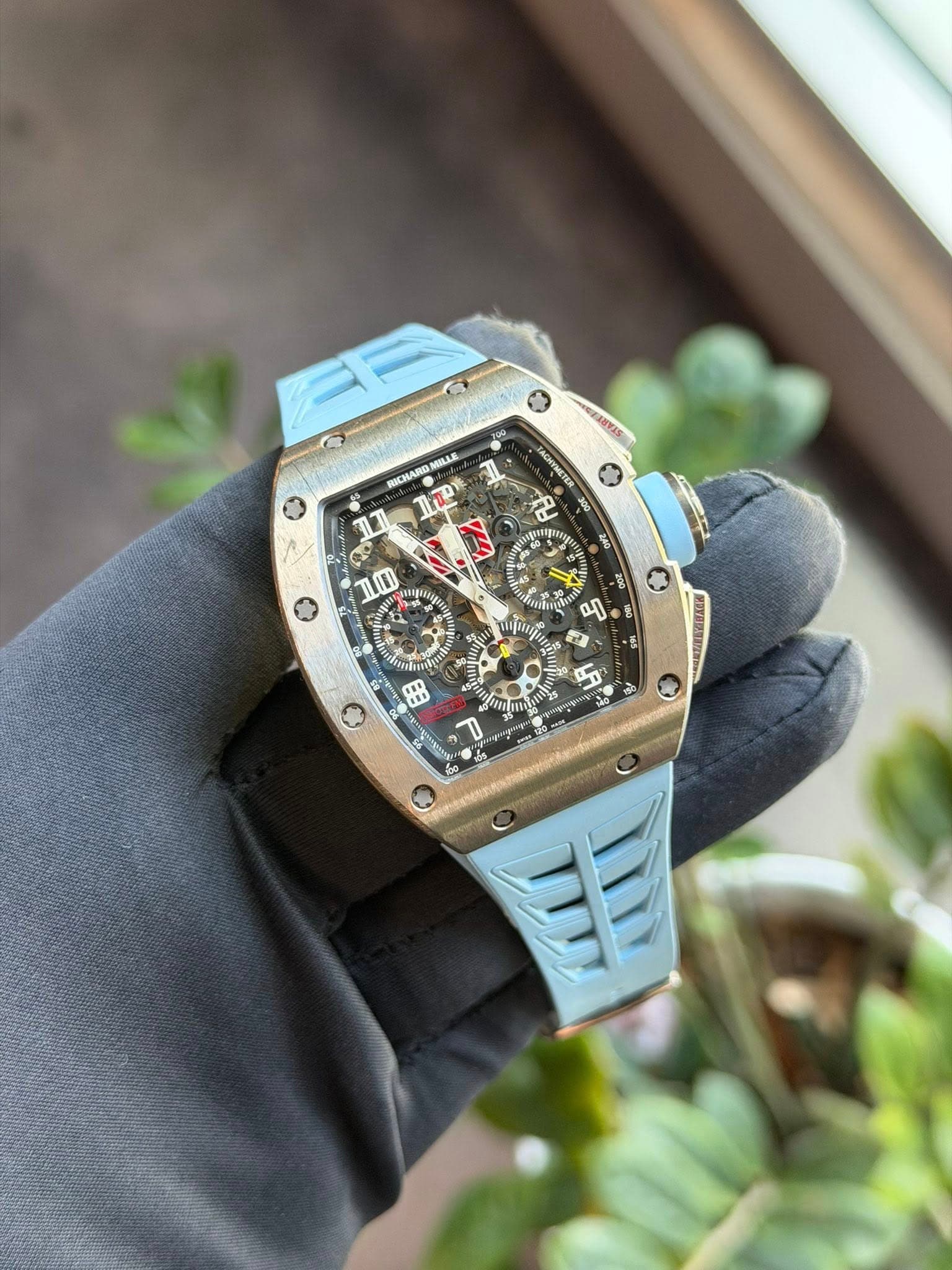 May be an image of wrist watch and text