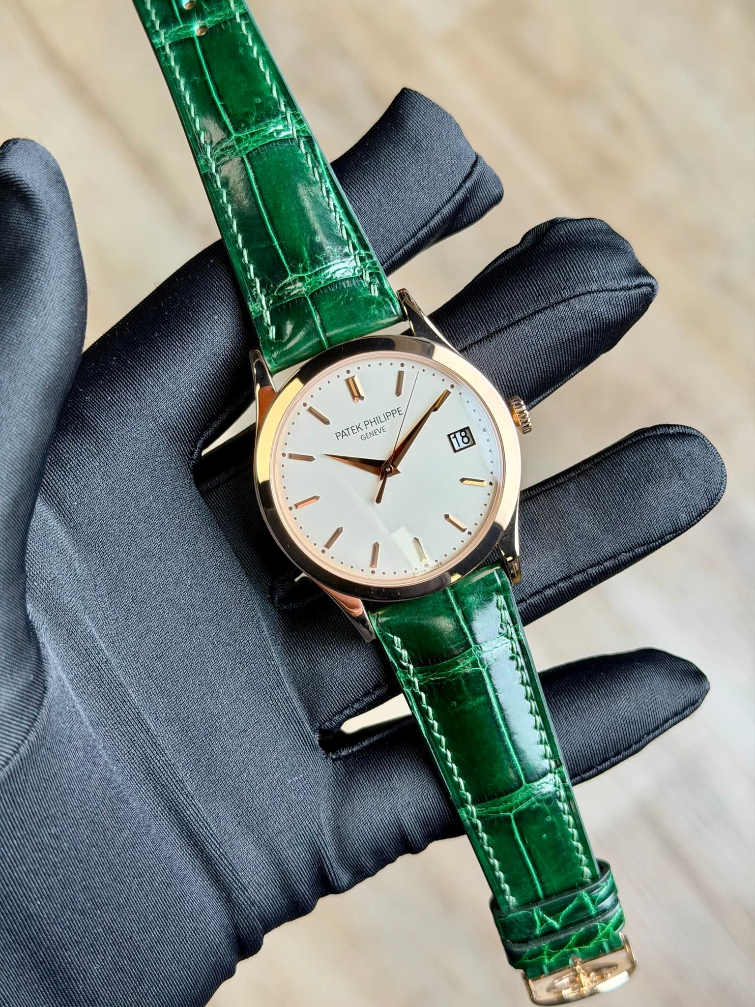 May be an image of leather, wrist watch and text