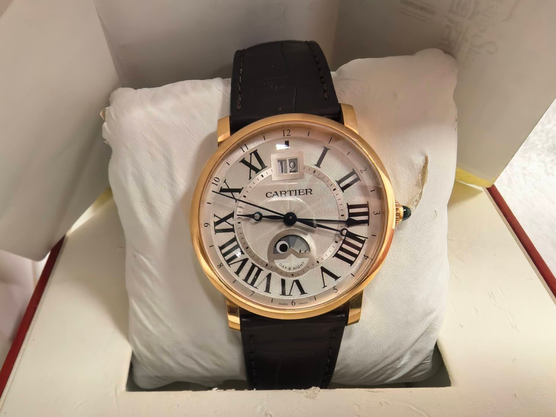 May be an image of wrist watch and text