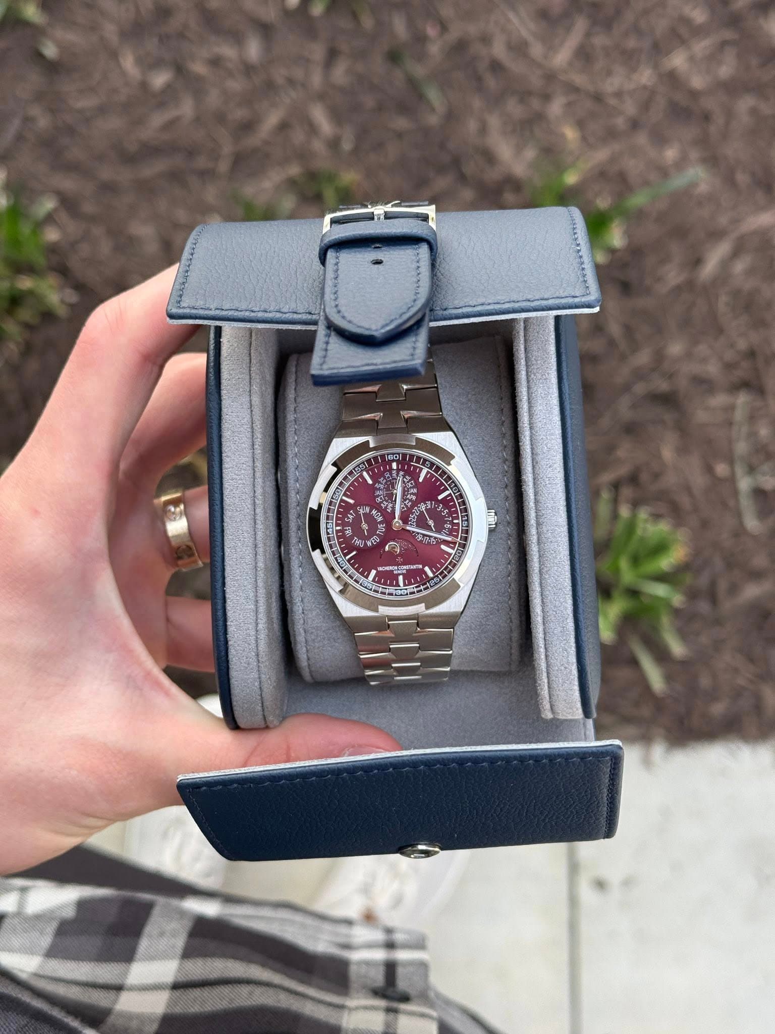 May be an image of wrist watch and text