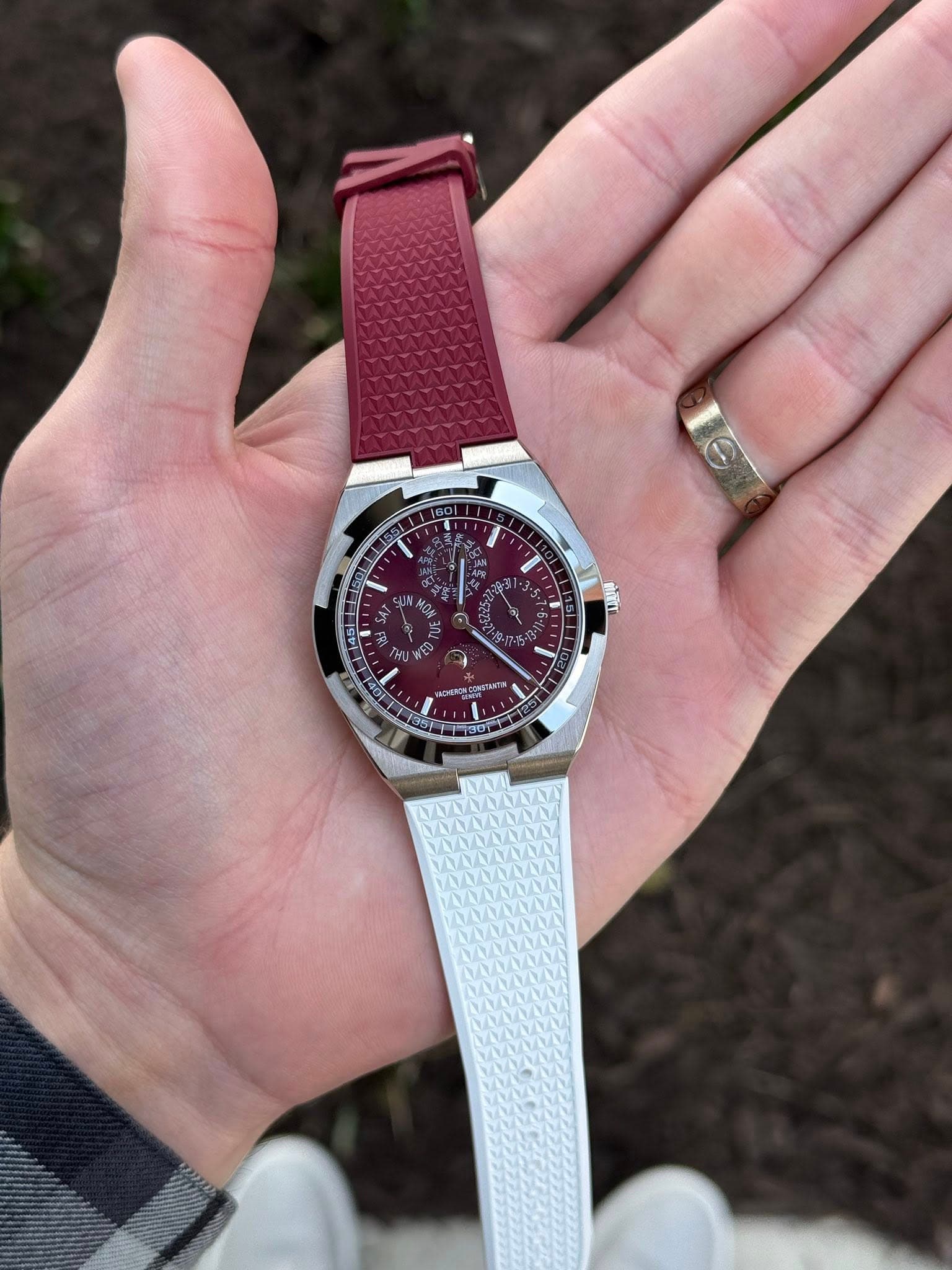 May be an image of wrist watch and text