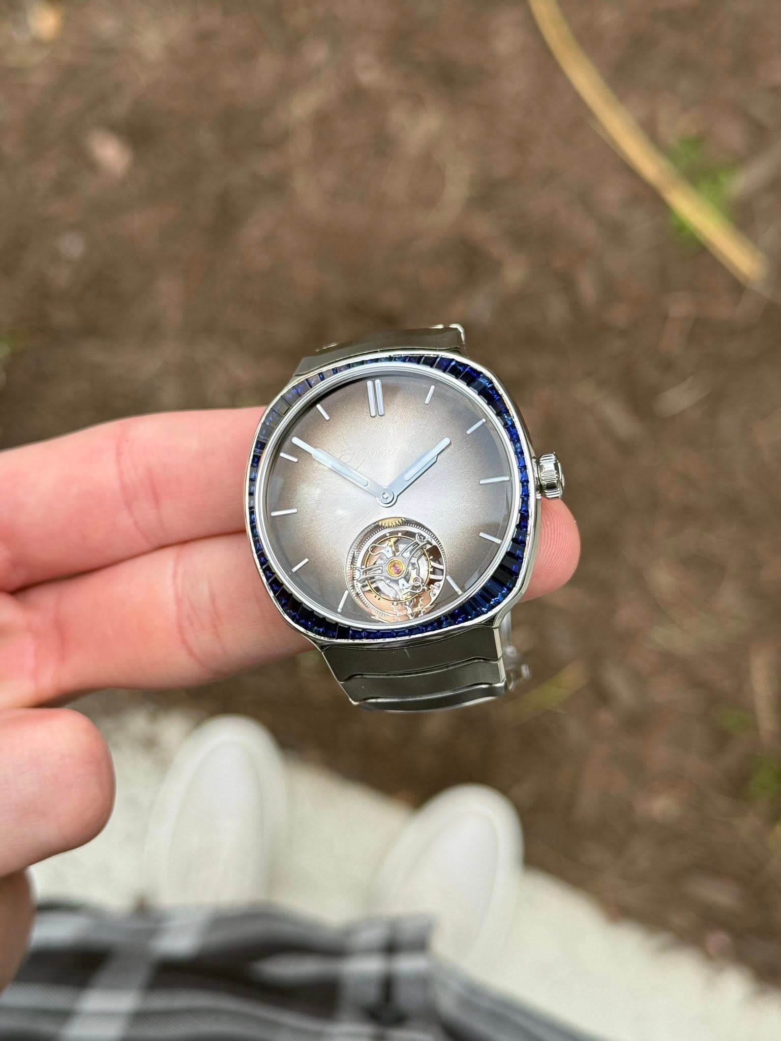 May be an image of wrist watch and text