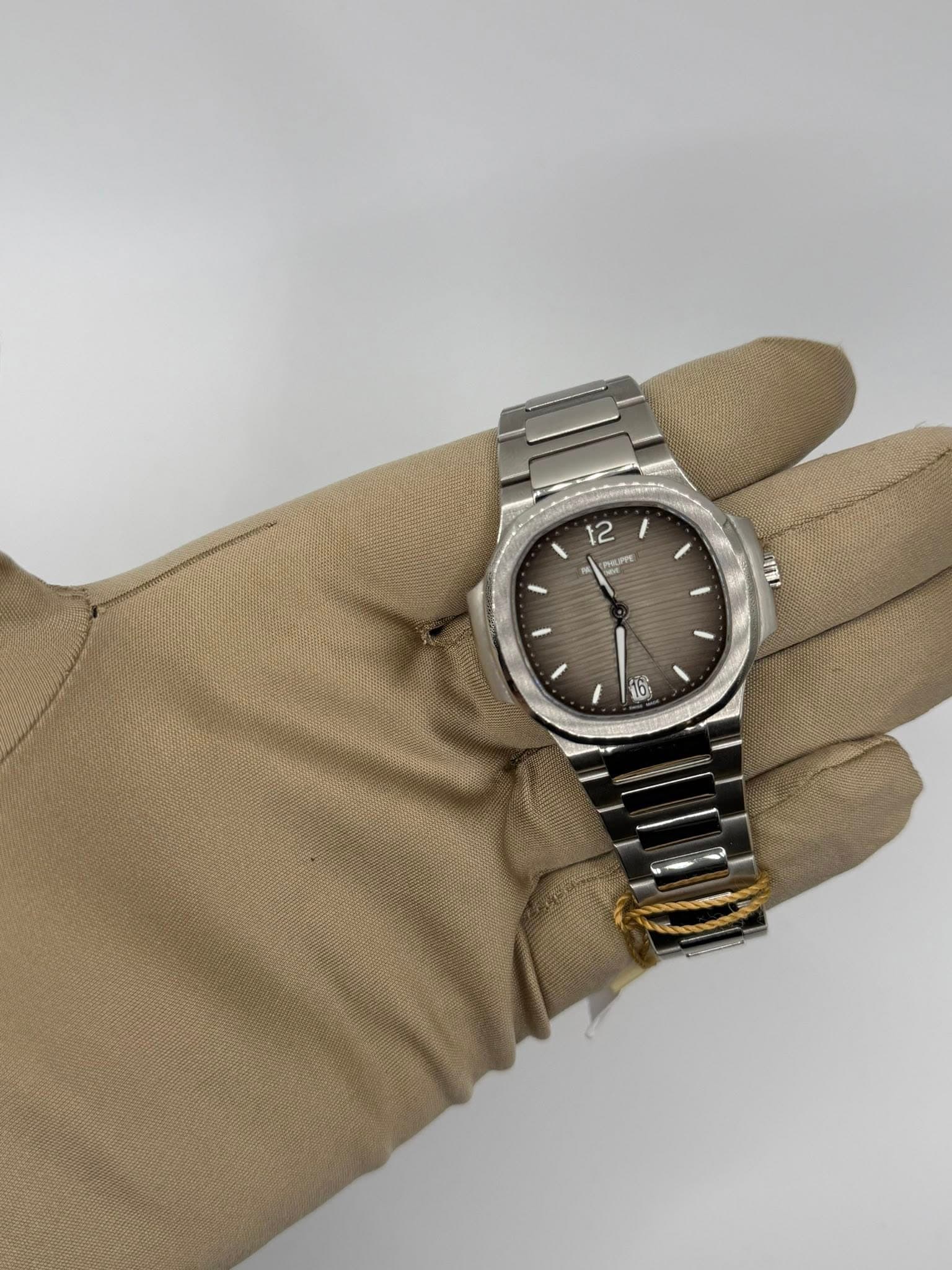 May be an image of wrist watch and text