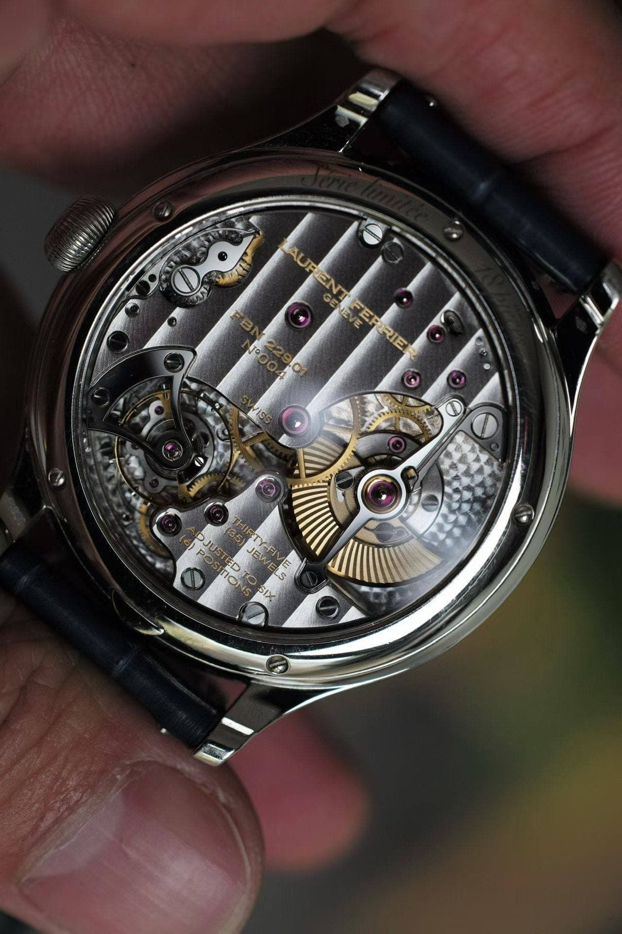 May be an image of wrist watch and text