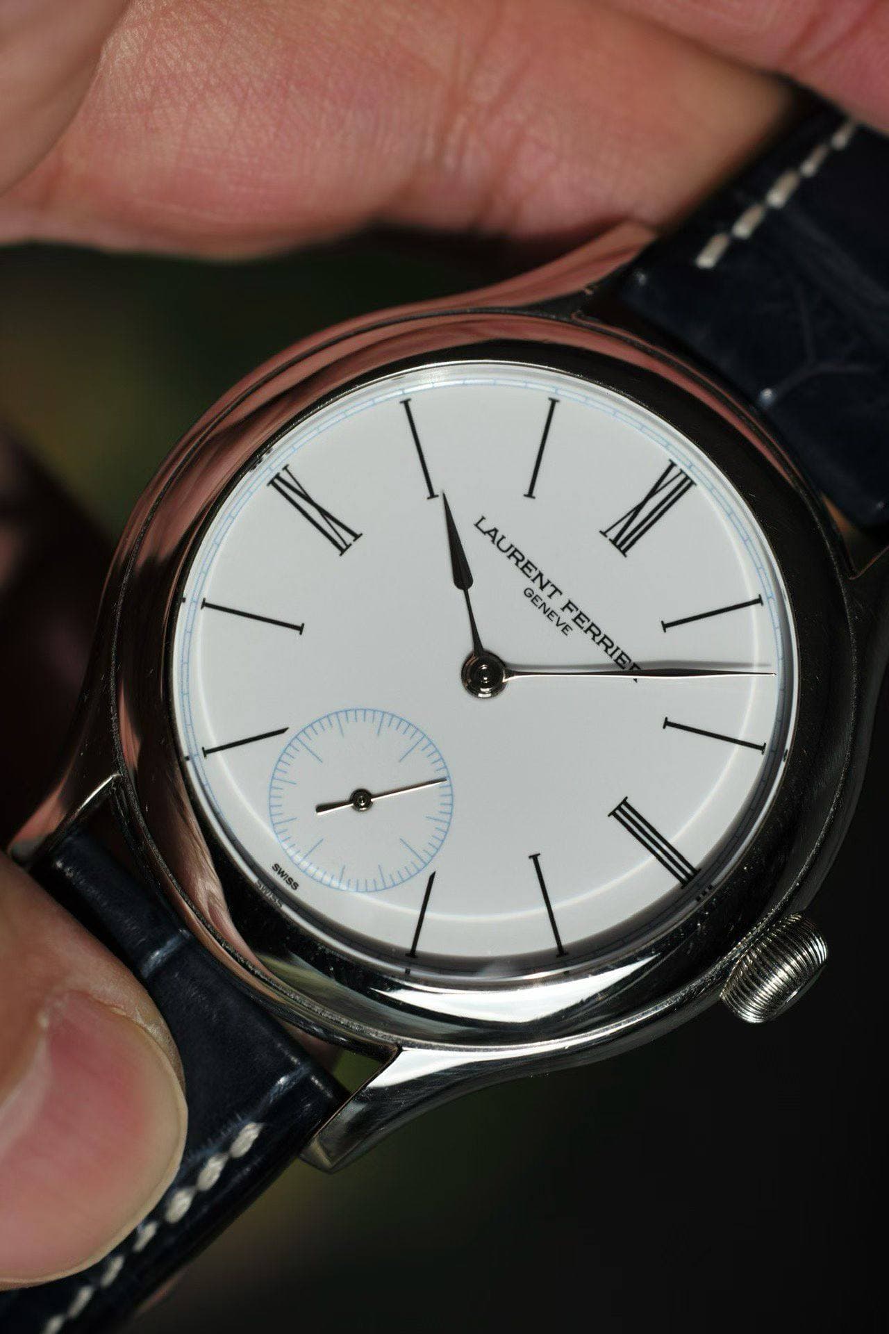 May be an image of wrist watch and text that says 'ا LAUREN I XII GENEVE LAURENTFERRIE GEN VE VE FERRIE FERRIE مللل ጣ SWISS Sla'