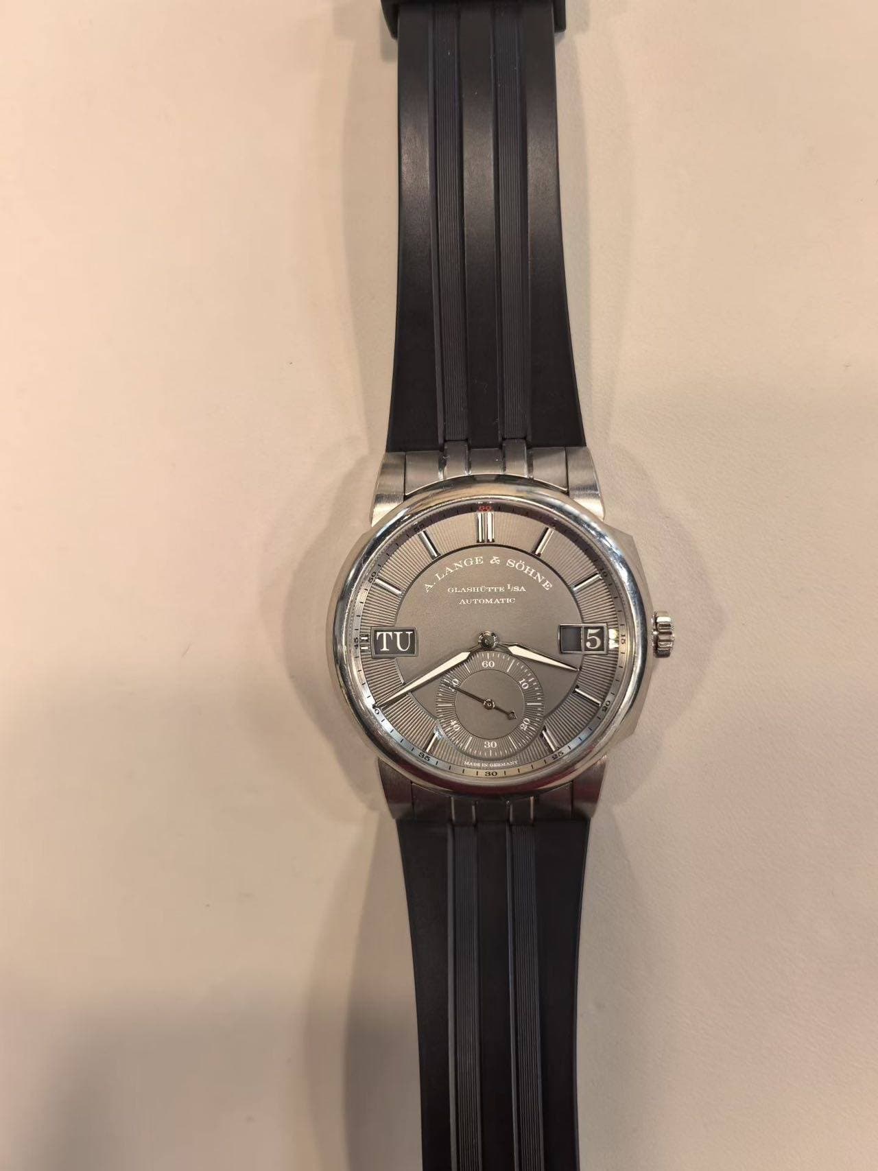 May be an image of leather and wrist watch