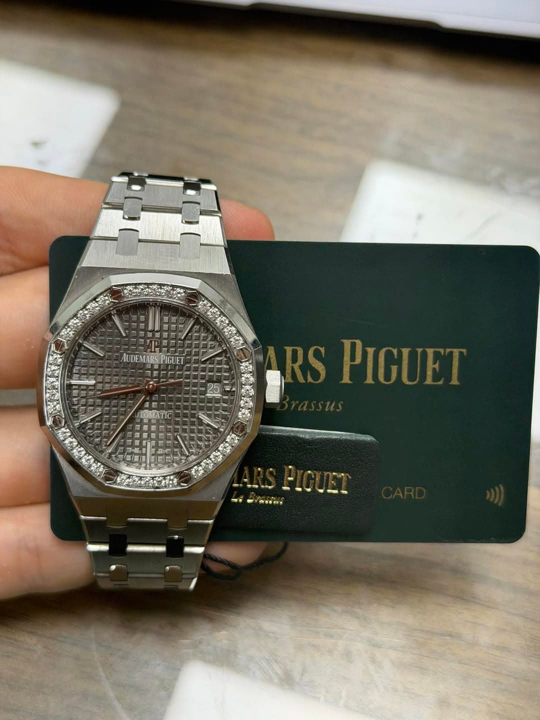 May be an image of wrist watch and text