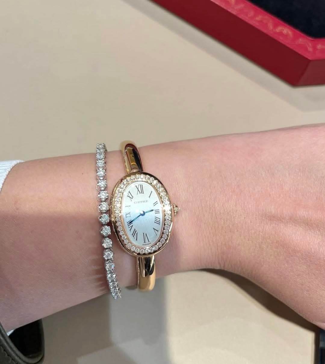 May be an image of wrist watch, jewelry and text