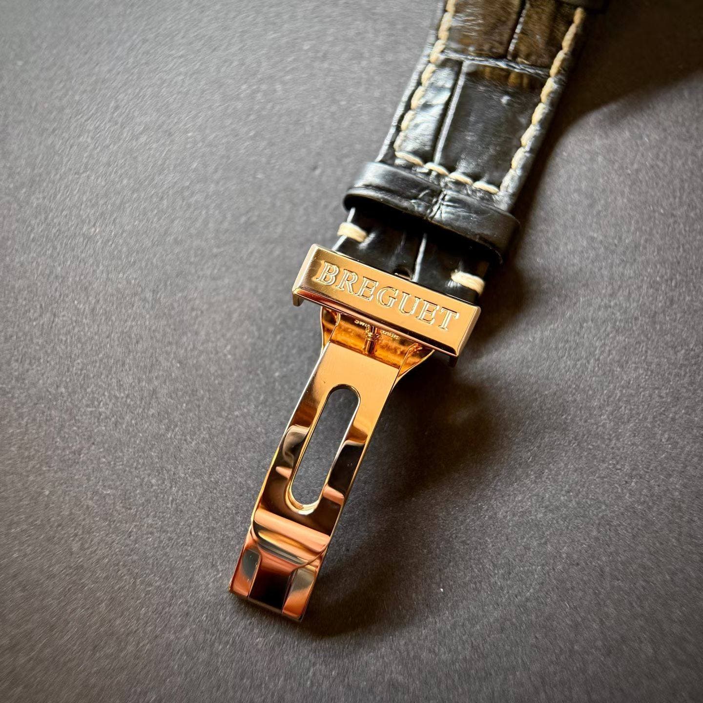 May be an image of leather, saddle-stitched leather and wrist watch