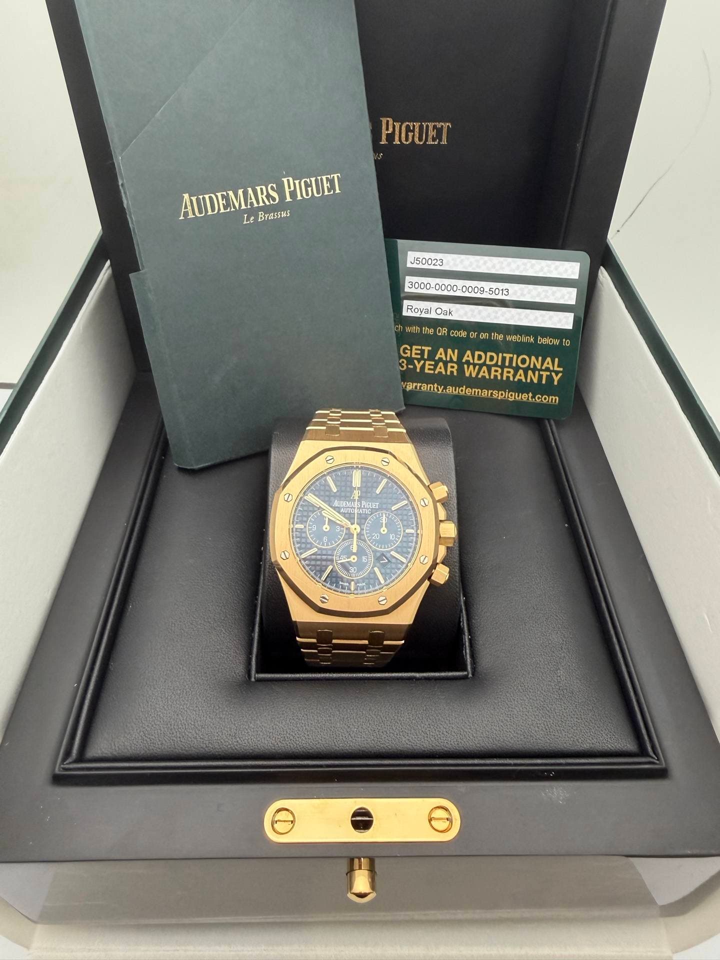 May be an image of wrist watch and text that says 'PIGUET AUDEMARS AUDEMARSPIGUET Lt PIGUET J50023 300D-C000- Royai Cak code gram ከበ Iie Meblink belora D GET AN WABRANTV…
