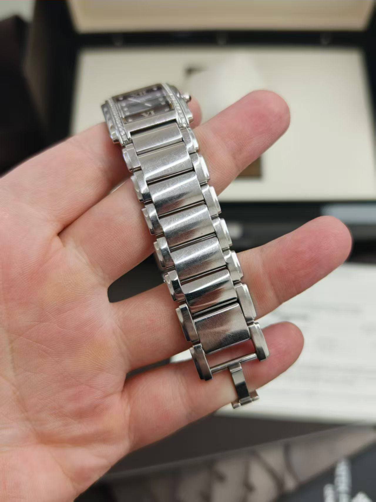May be an image of wrist watch