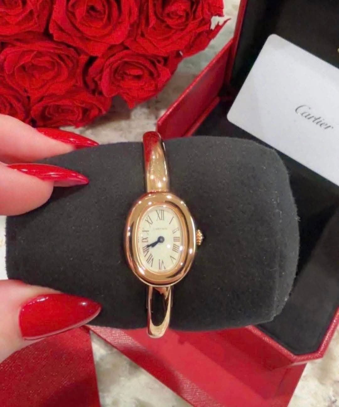 May be an image of wrist watch and text