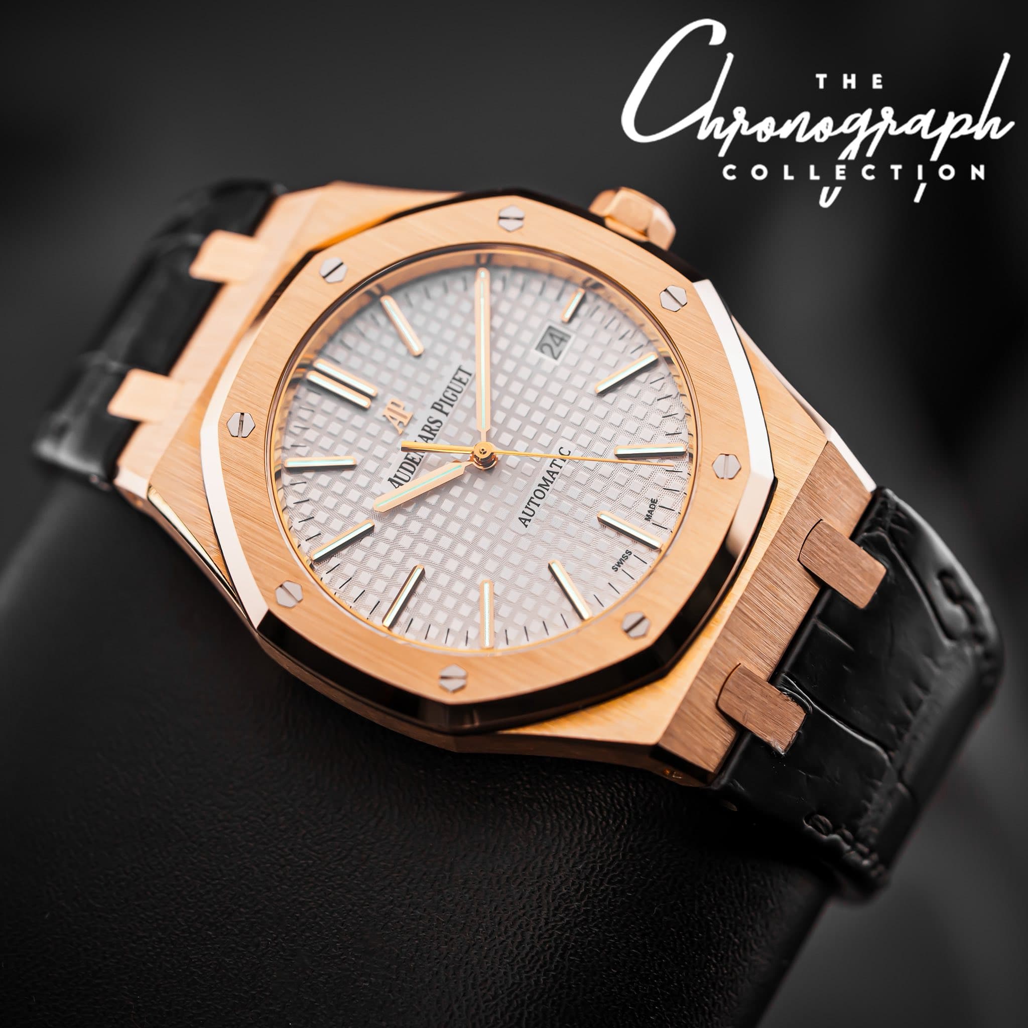 May be an image of wrist watch and text that says 'T THE Anranagaph E nponograph COLLECTION COLLE - 24 AR ARS 1 PIGUET AUDE O AUTOMATI'