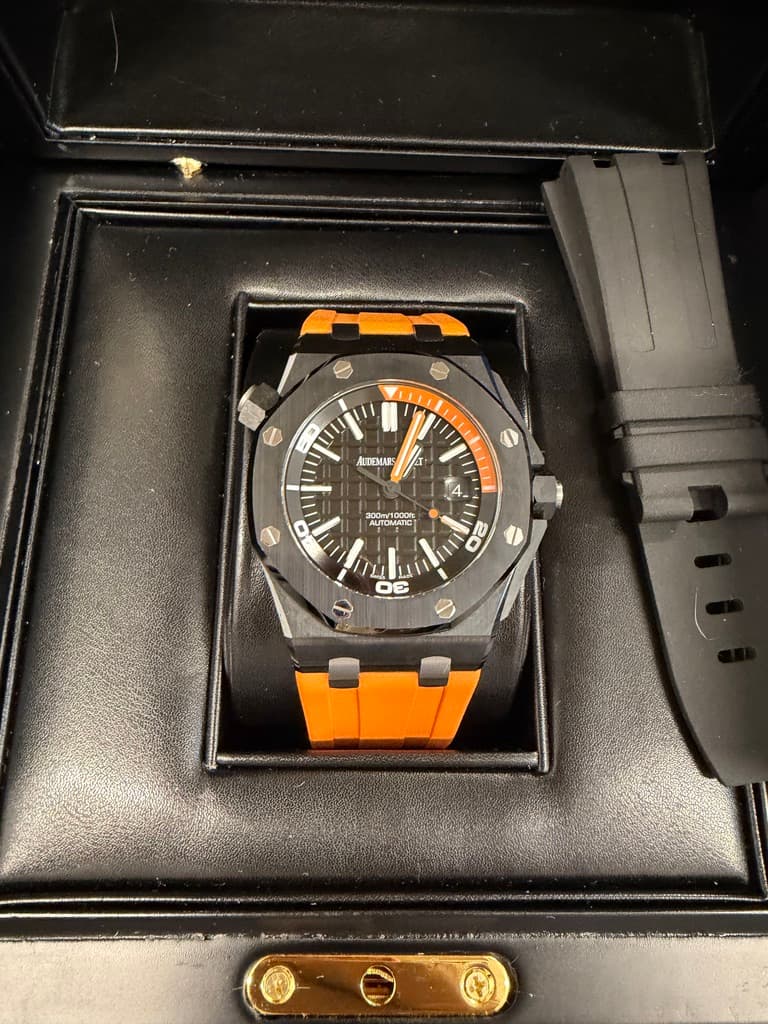 May be an image of wrist watch and text that says 'ហ ACTFMARS 300m/1000 10m/1000 AUTOMATC AUTOM 20 DE 0'