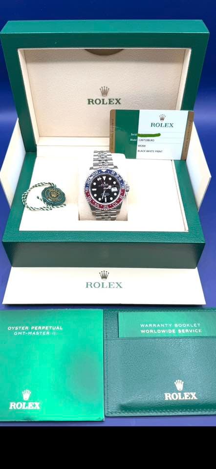 May be an image of text that says 'ROLEX ROLEX မ်သေ 126PI0BLAO 69200 መዳ • • நிம் W ROLEX OYSTERPERPETUAL OYSTER PERPETUAL GMT-MASTERII WARRANTYBOOKLET WARRANTY BOOKLET WORLDWIDE…