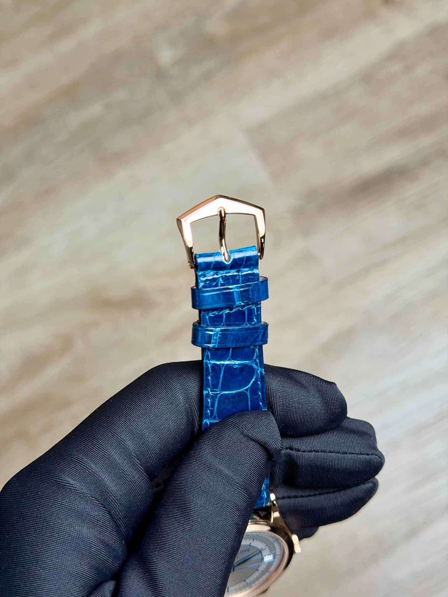 May be an image of wrist watch and saddle-stitched leather