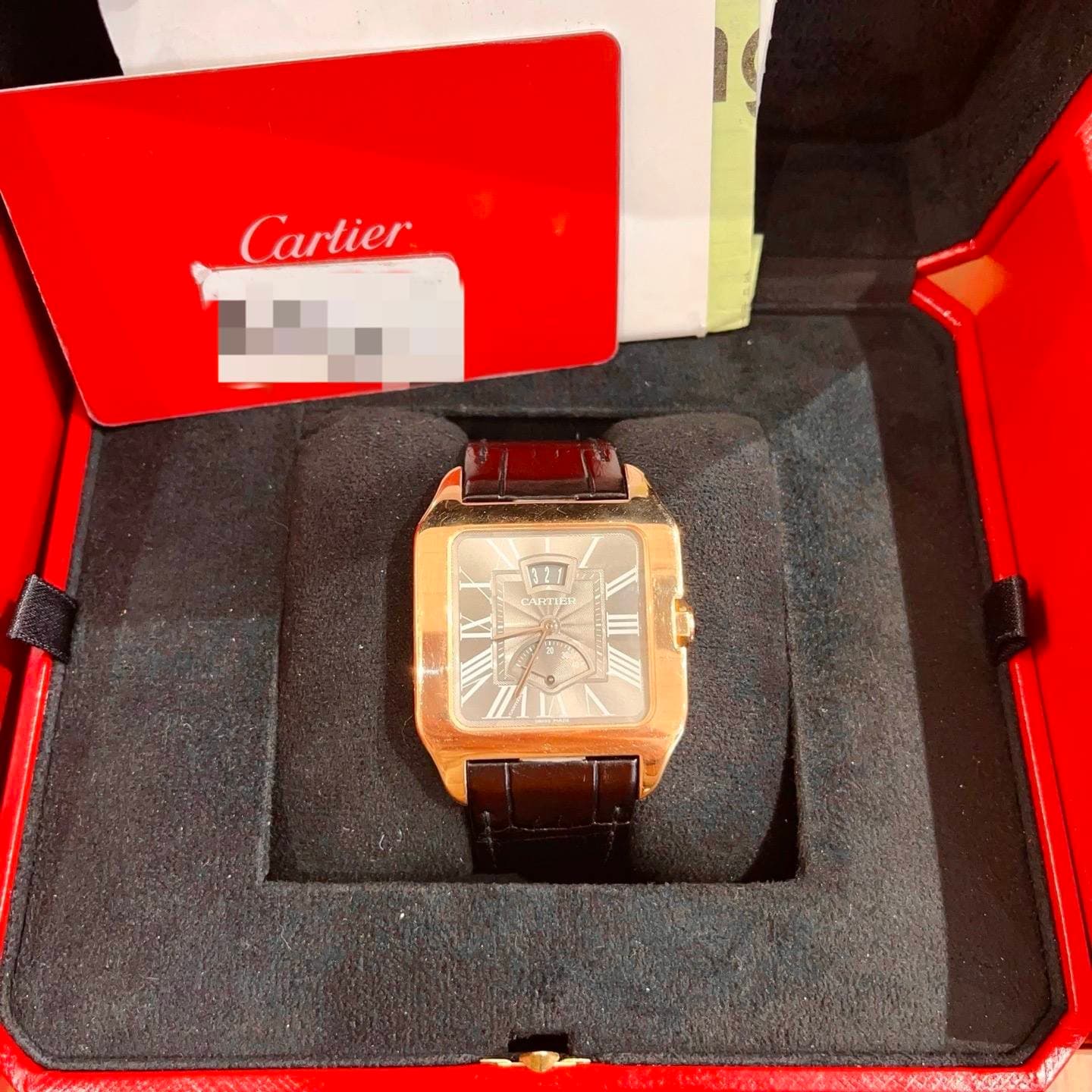 May be an image of wrist watch and text that says 'Cartier 321'