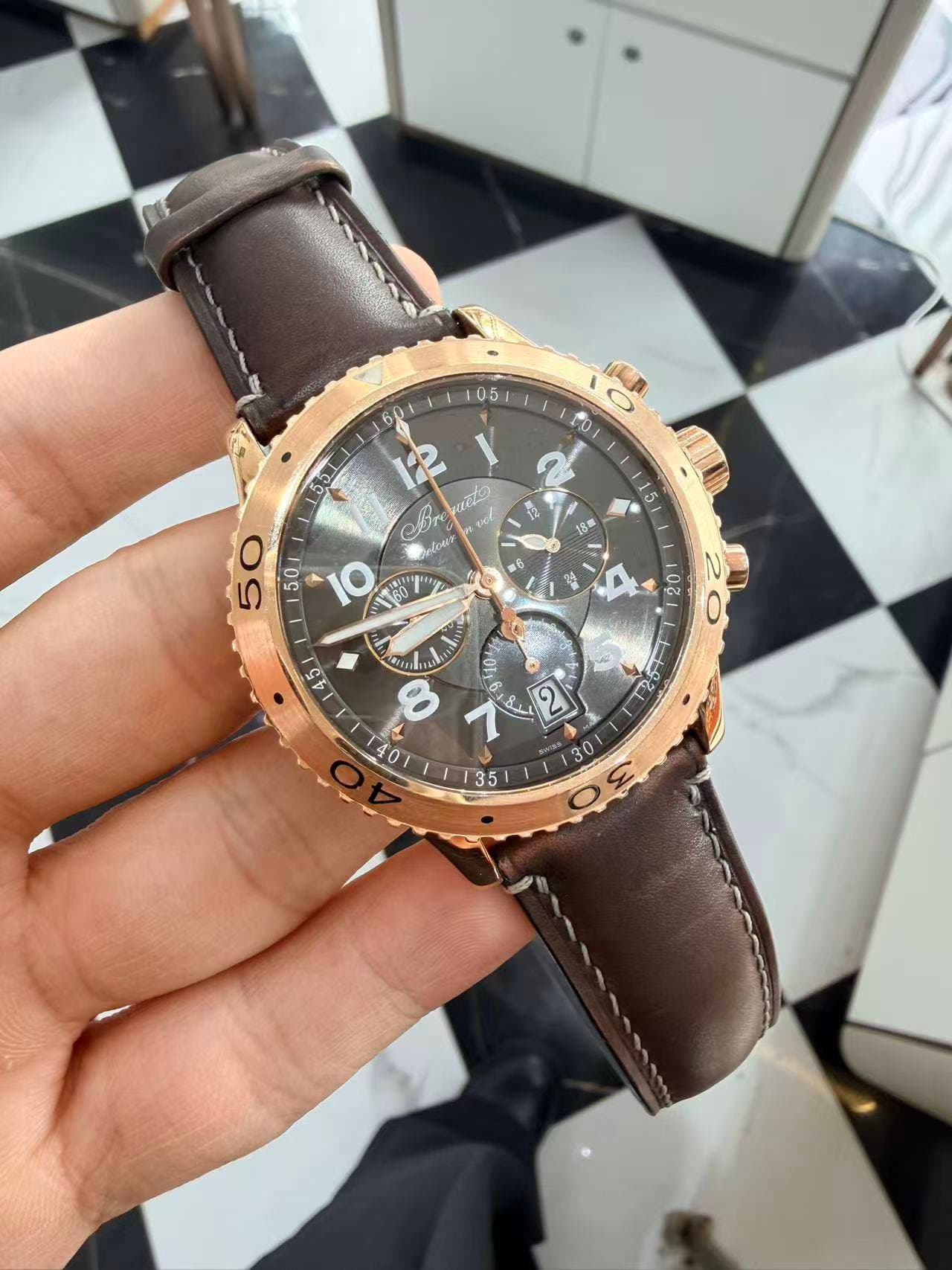 May be an image of wrist watch and text