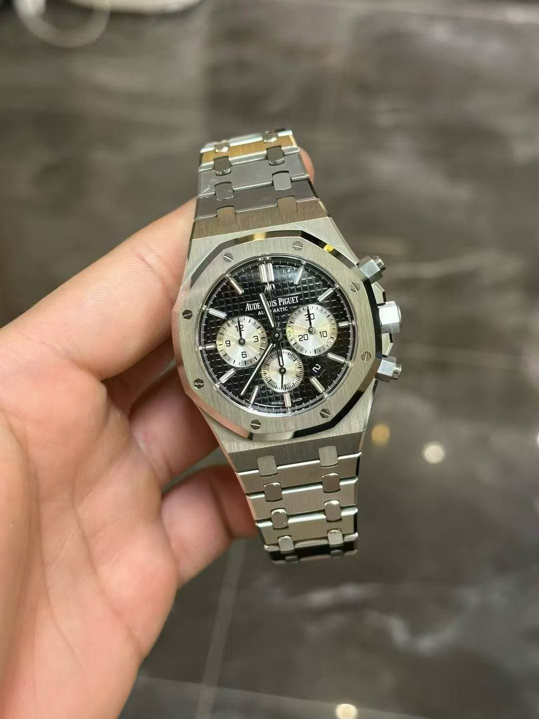 May be an image of wrist watch and text
