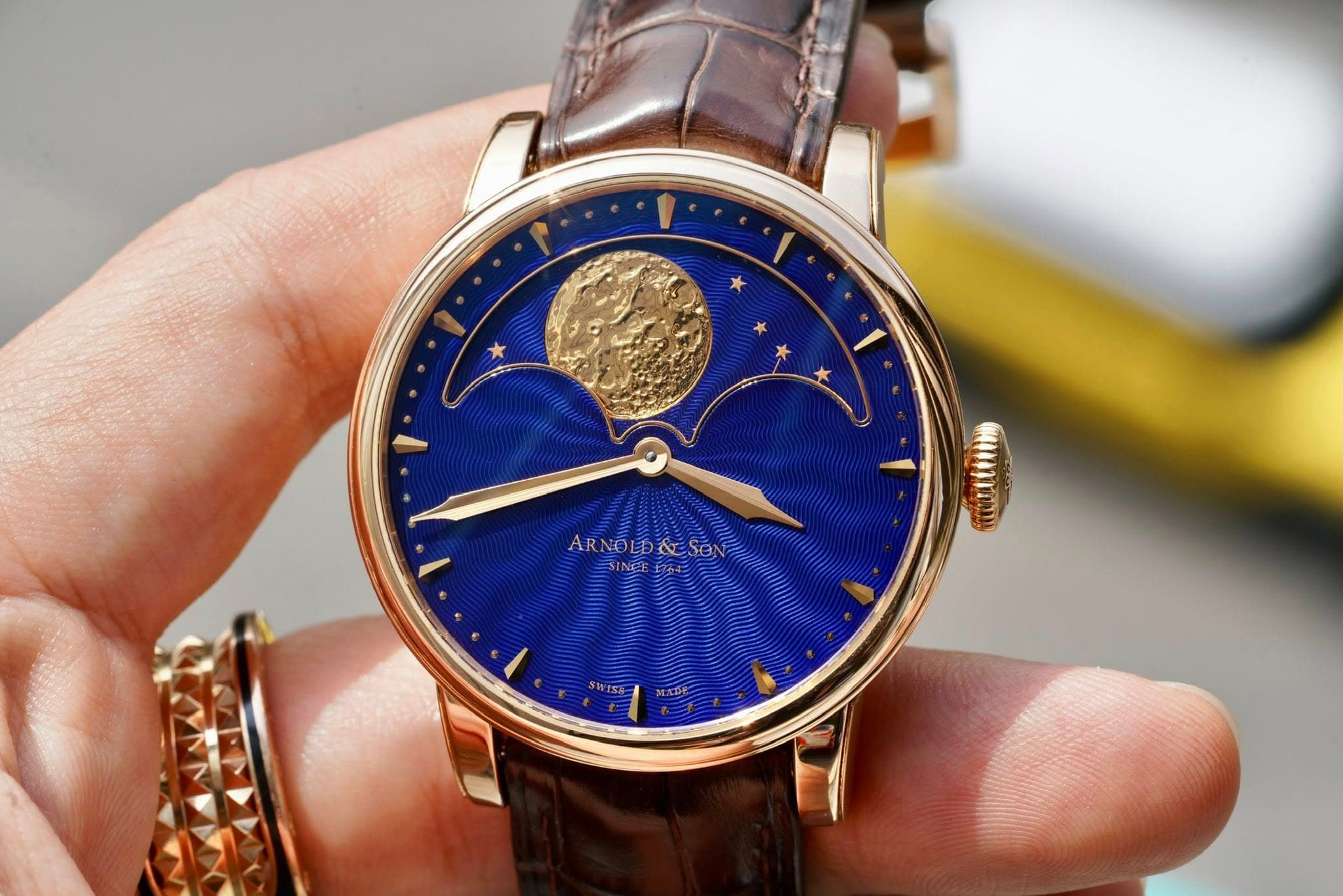 May be an image of wrist watch and text
