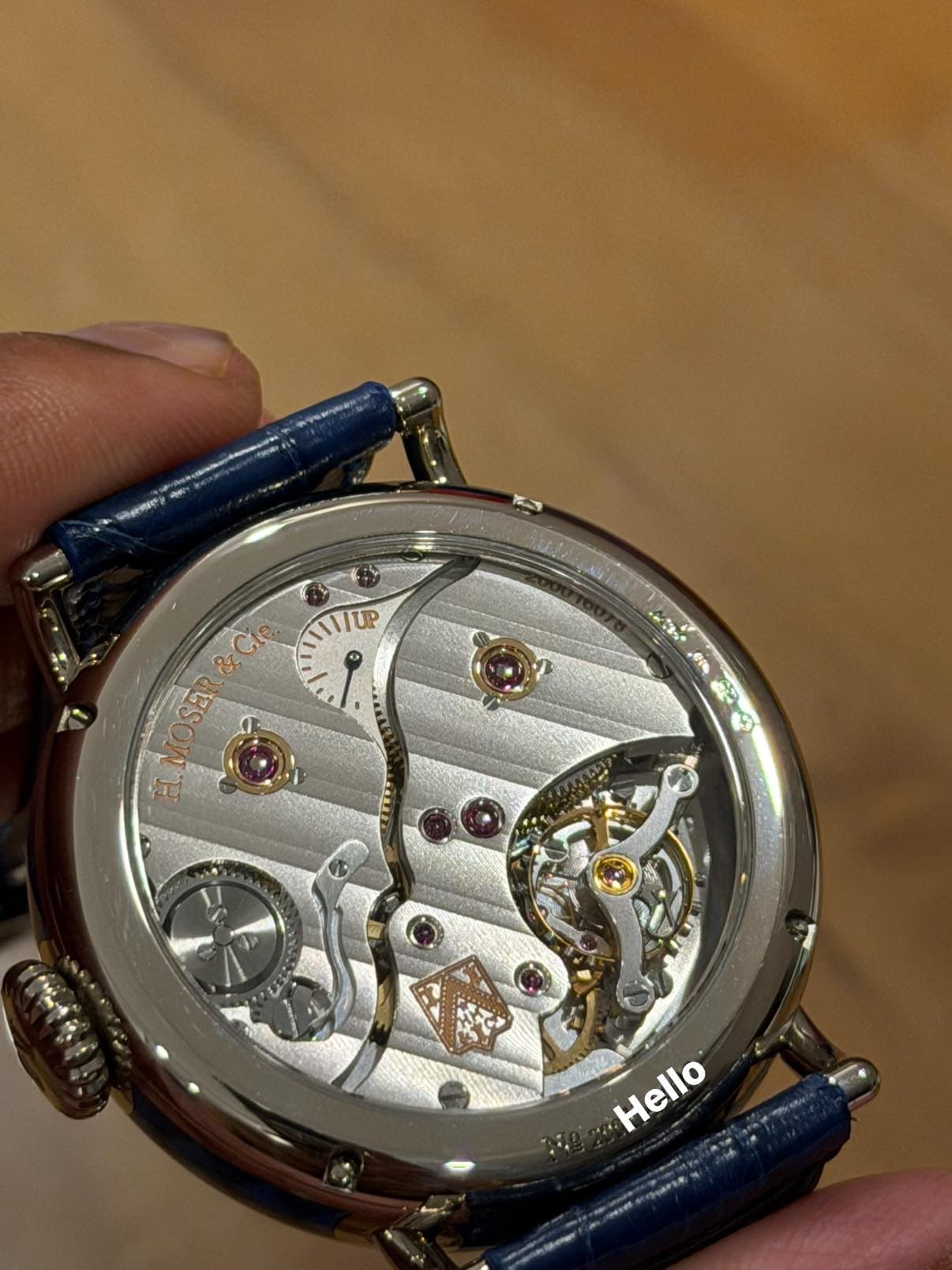 May be an image of wrist watch and text that says 'Cie 1//UP UP EI.MOSER SE MOSE H 니 Hello'