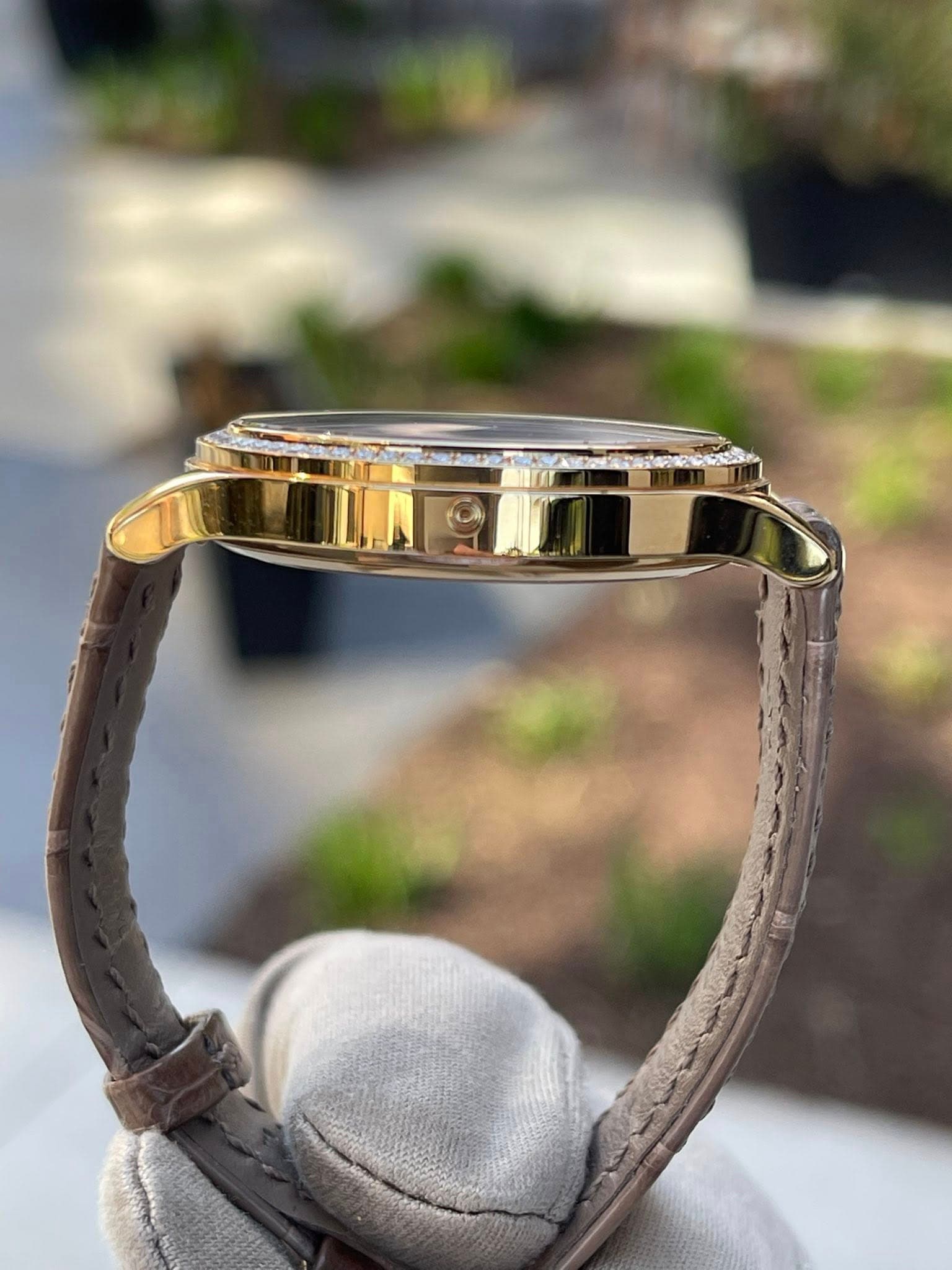 May be an image of jewelry, wrist watch and leather