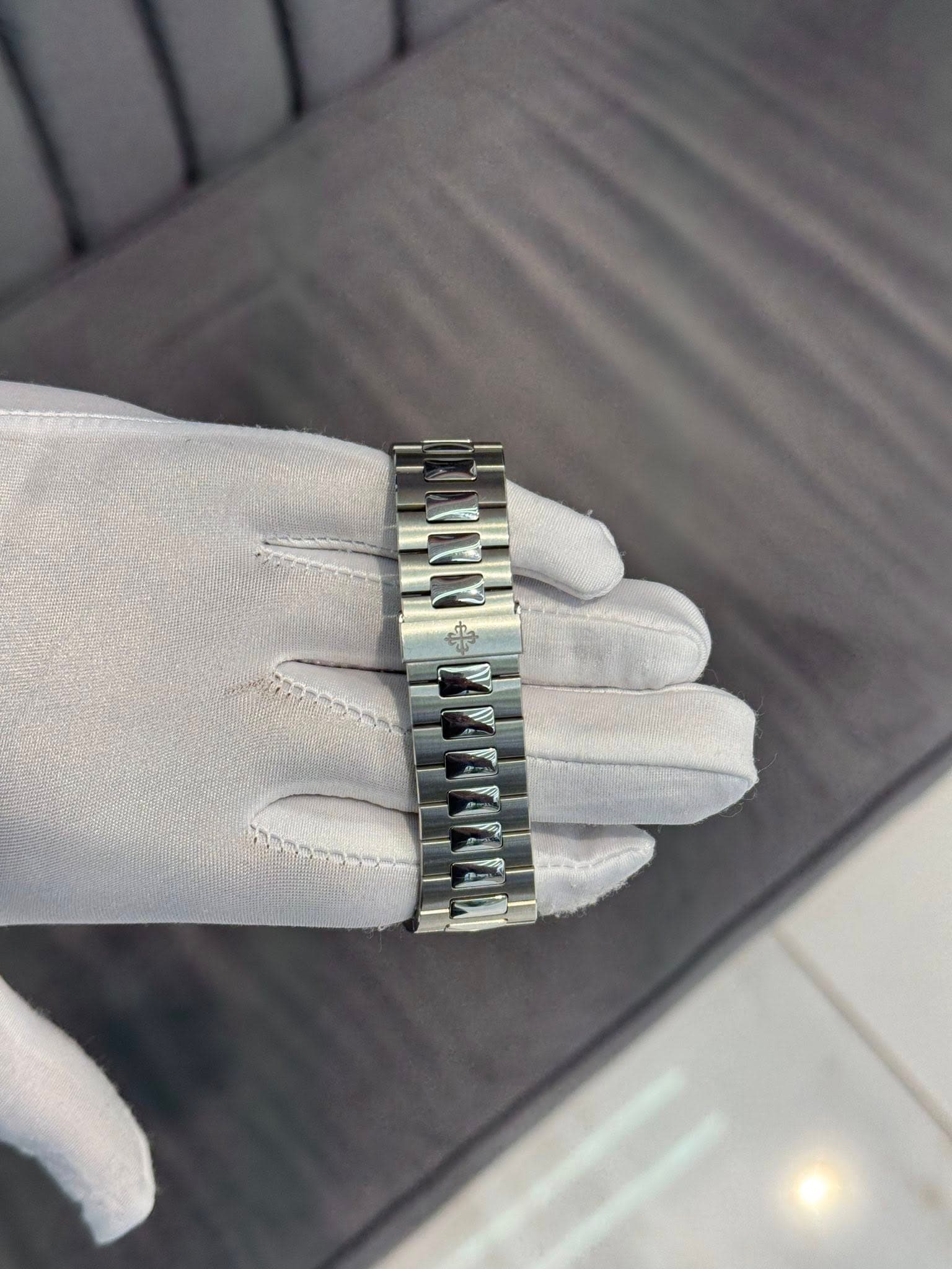 May be an image of jewelry, wrist watch and text