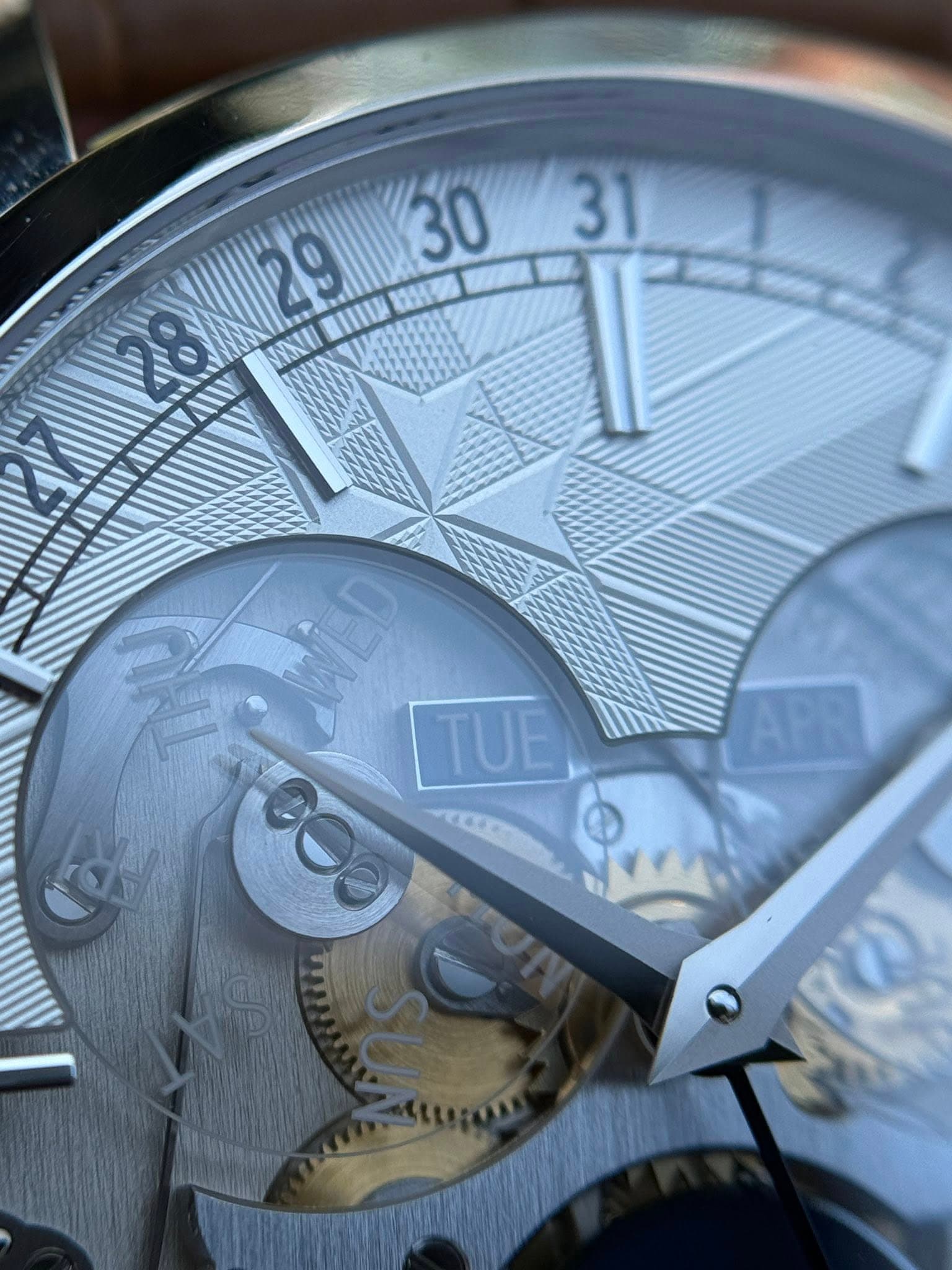 May be an image of wrist watch and text