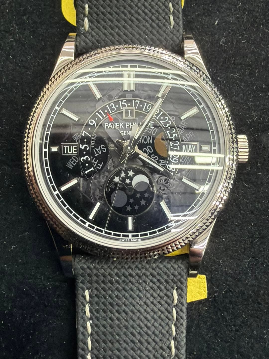 May be an image of leather, wrist watch and text that says '1ा ن 19 PANEK PATEKPHI PH GEN ON ತಿ TUE ED TITO SAS n0 ഗ 29 I I SWISS SWISSMADE MADE'