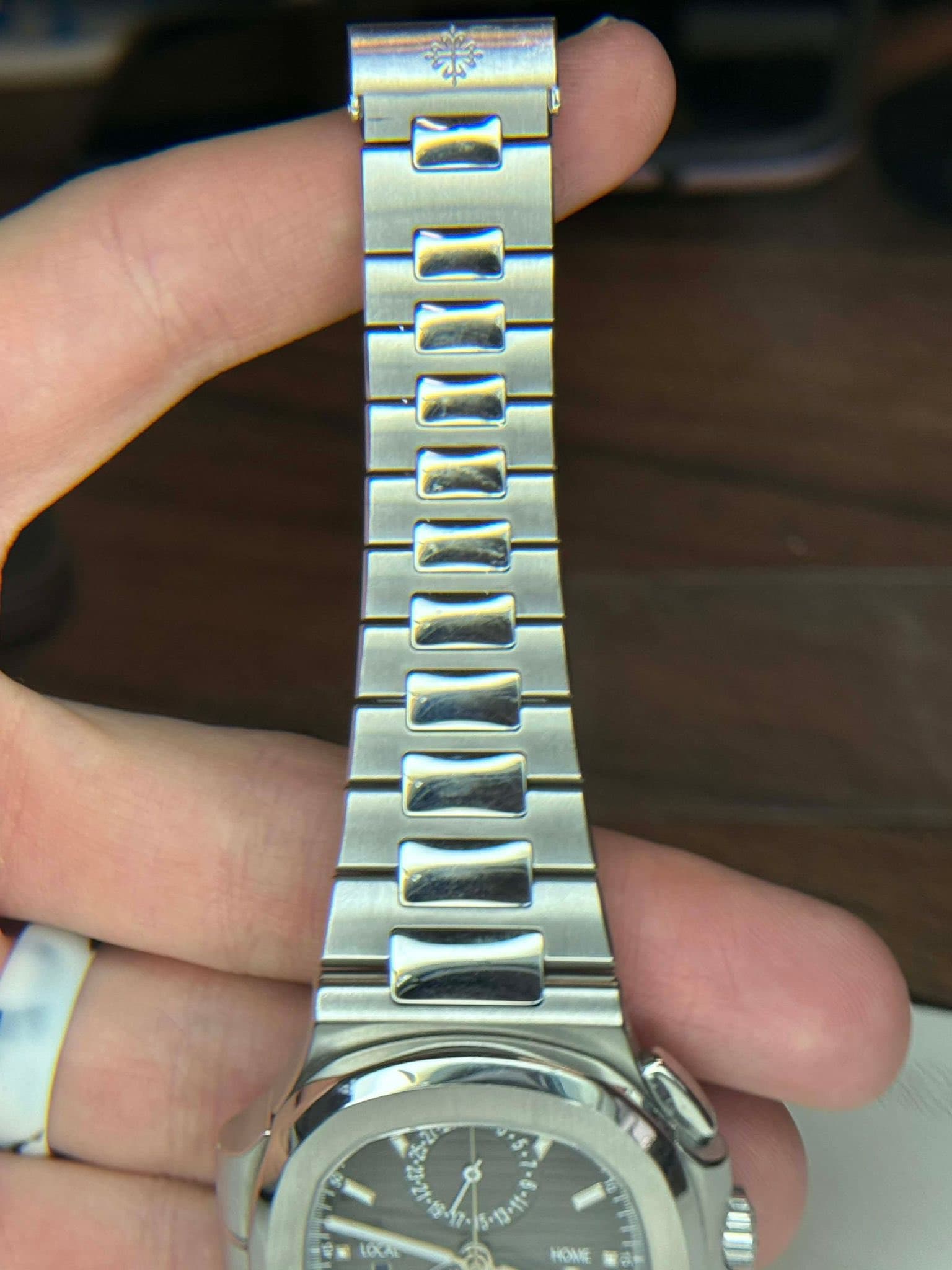 May be an image of wrist watch and text