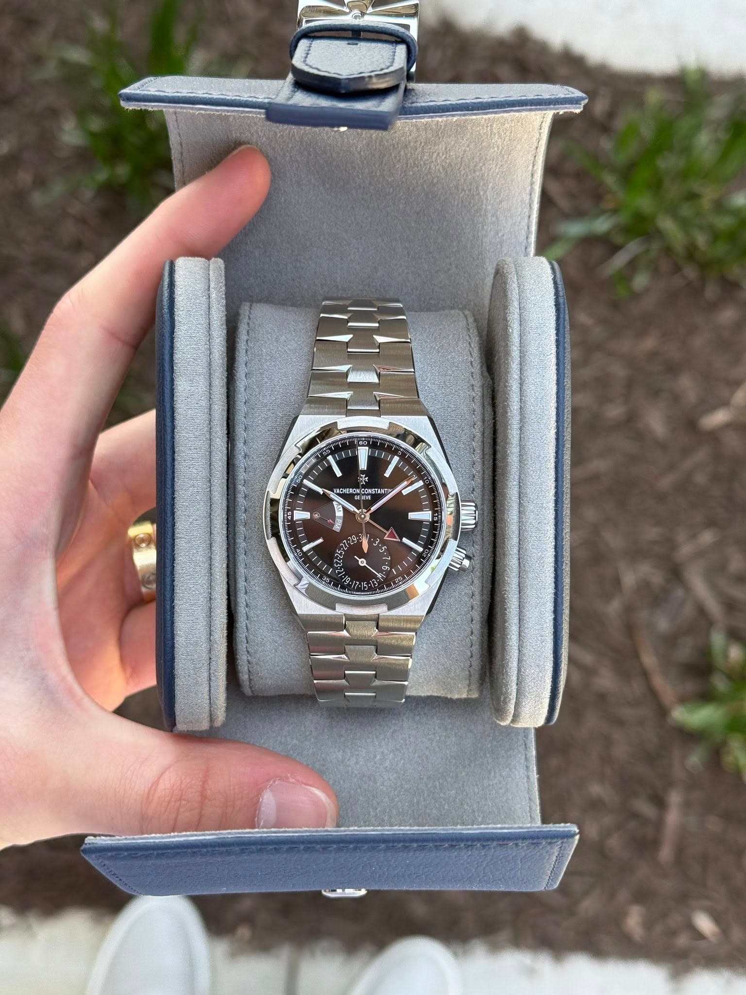 May be an image of wrist watch and text