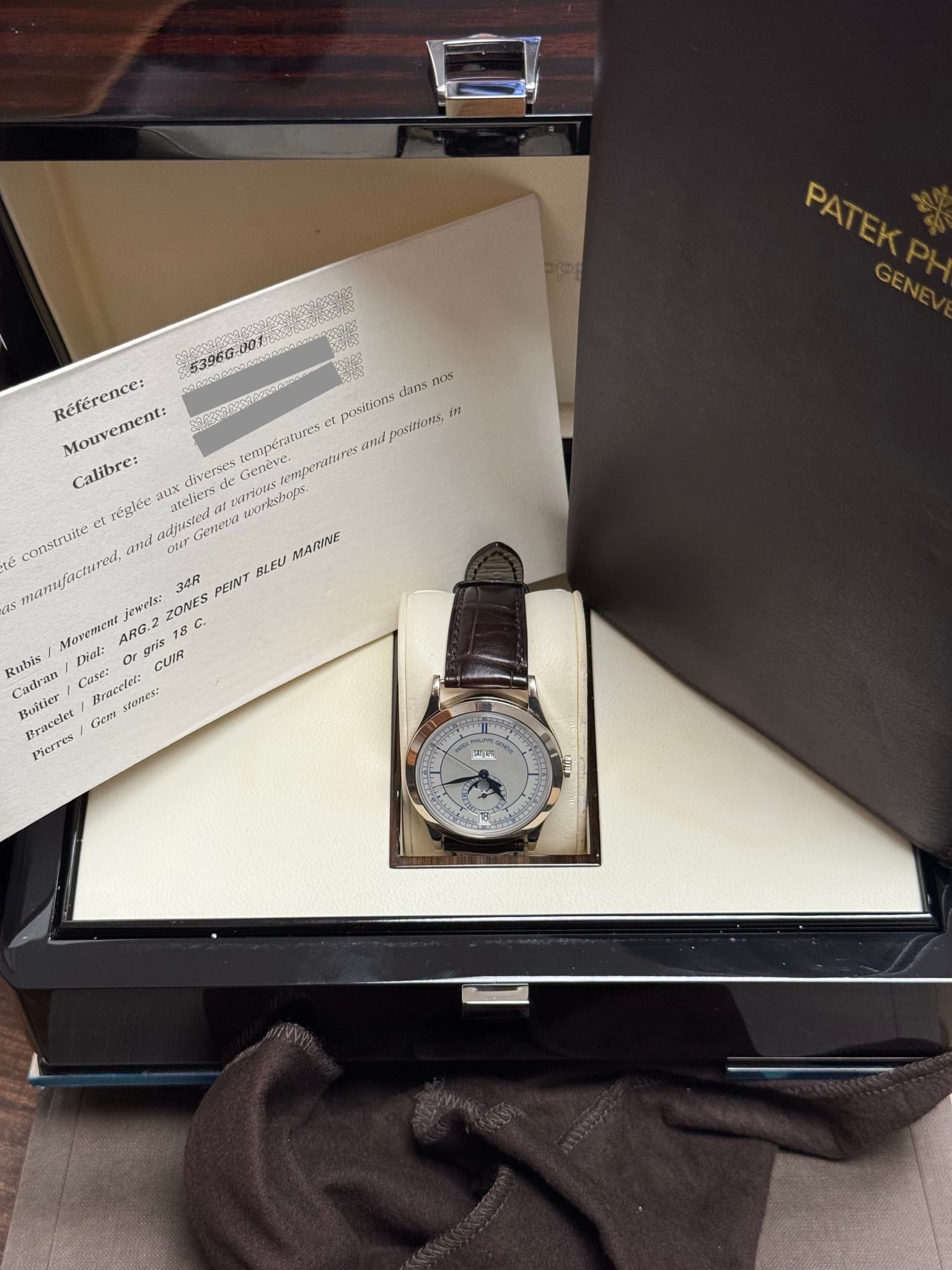 May be an image of wrist watch and text that says 'រតត PATEK PATEK GEN 53960.0 5396G-001 Reference: Mouvement: rempératures et pasitions dans nos pasitions 121 Calibre: diverses…
