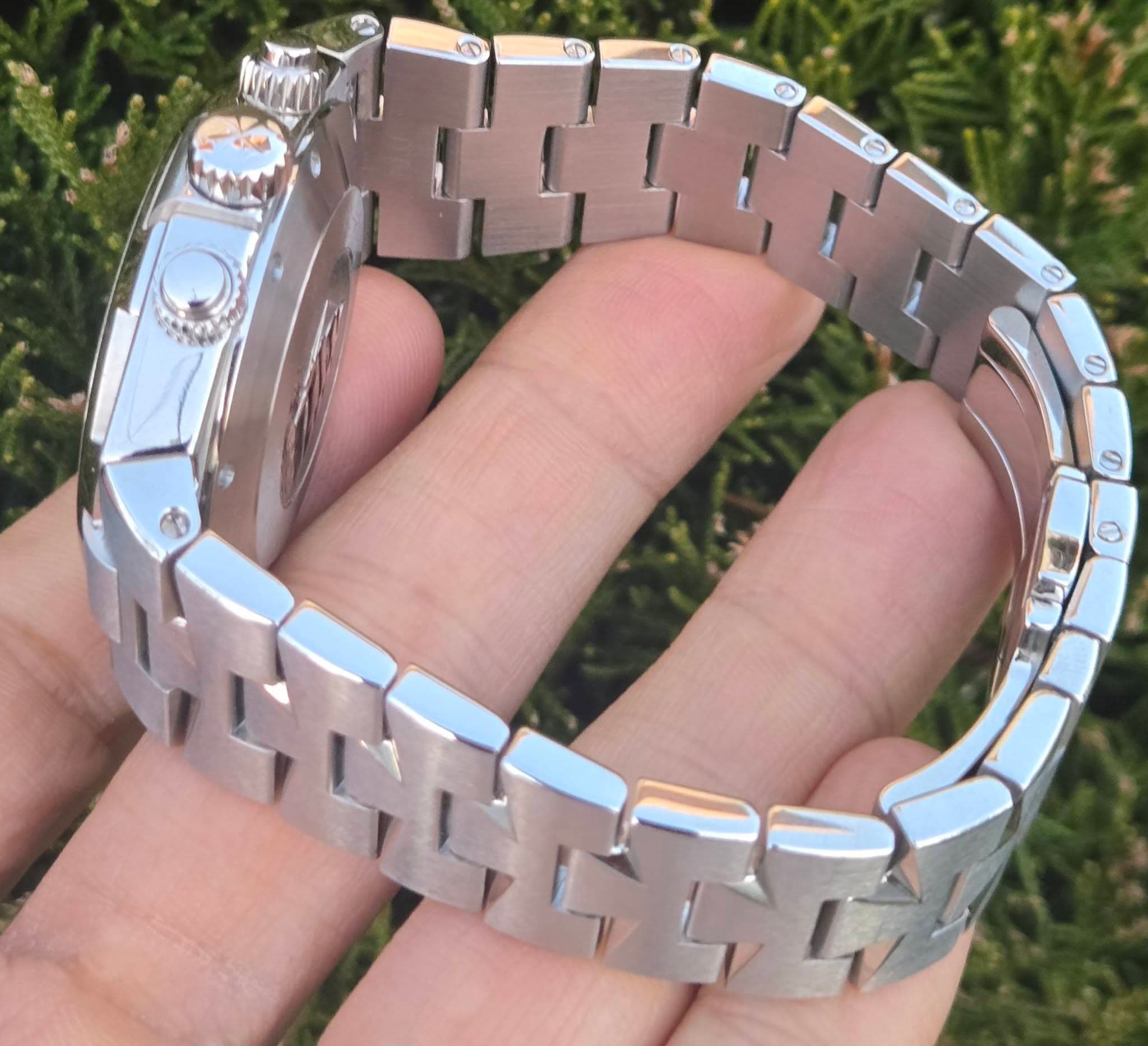 May be an image of wrist watch and text