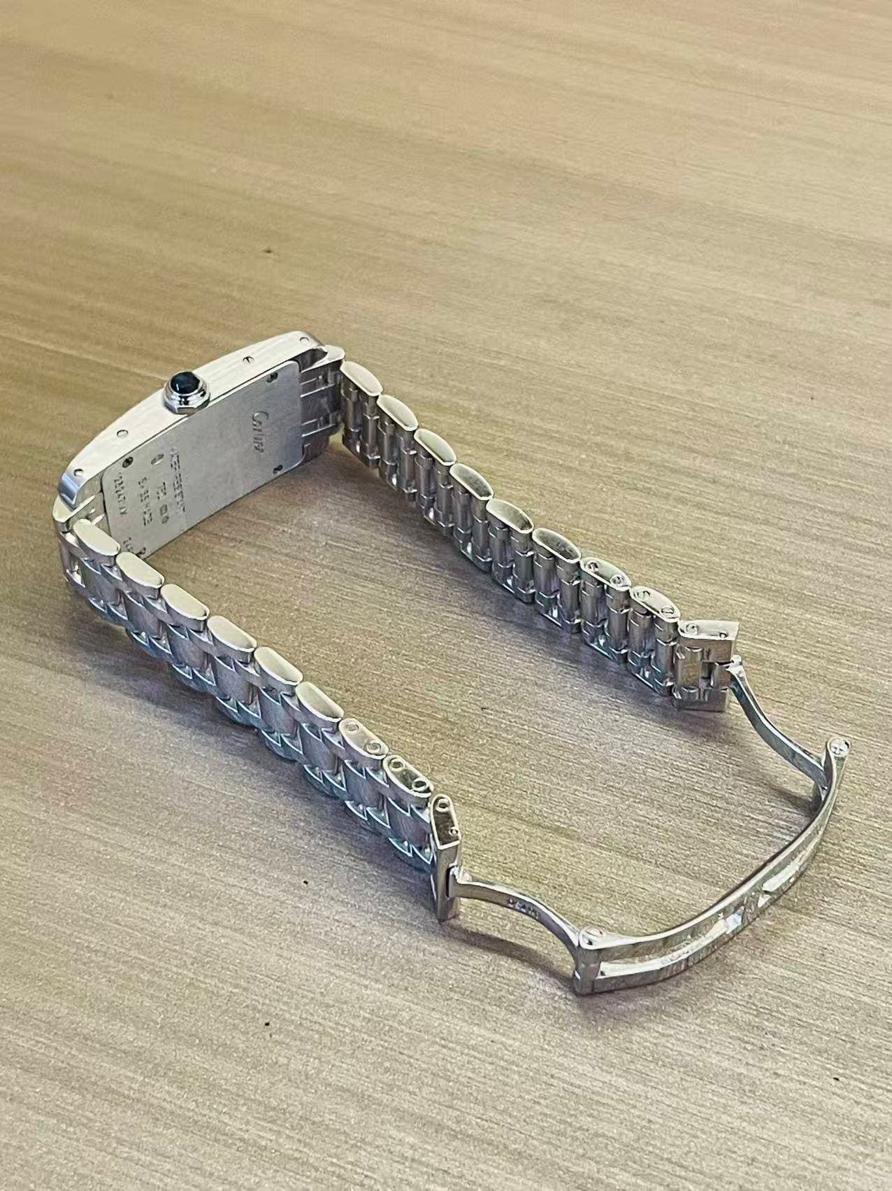 May be an image of wrist watch and jewelry